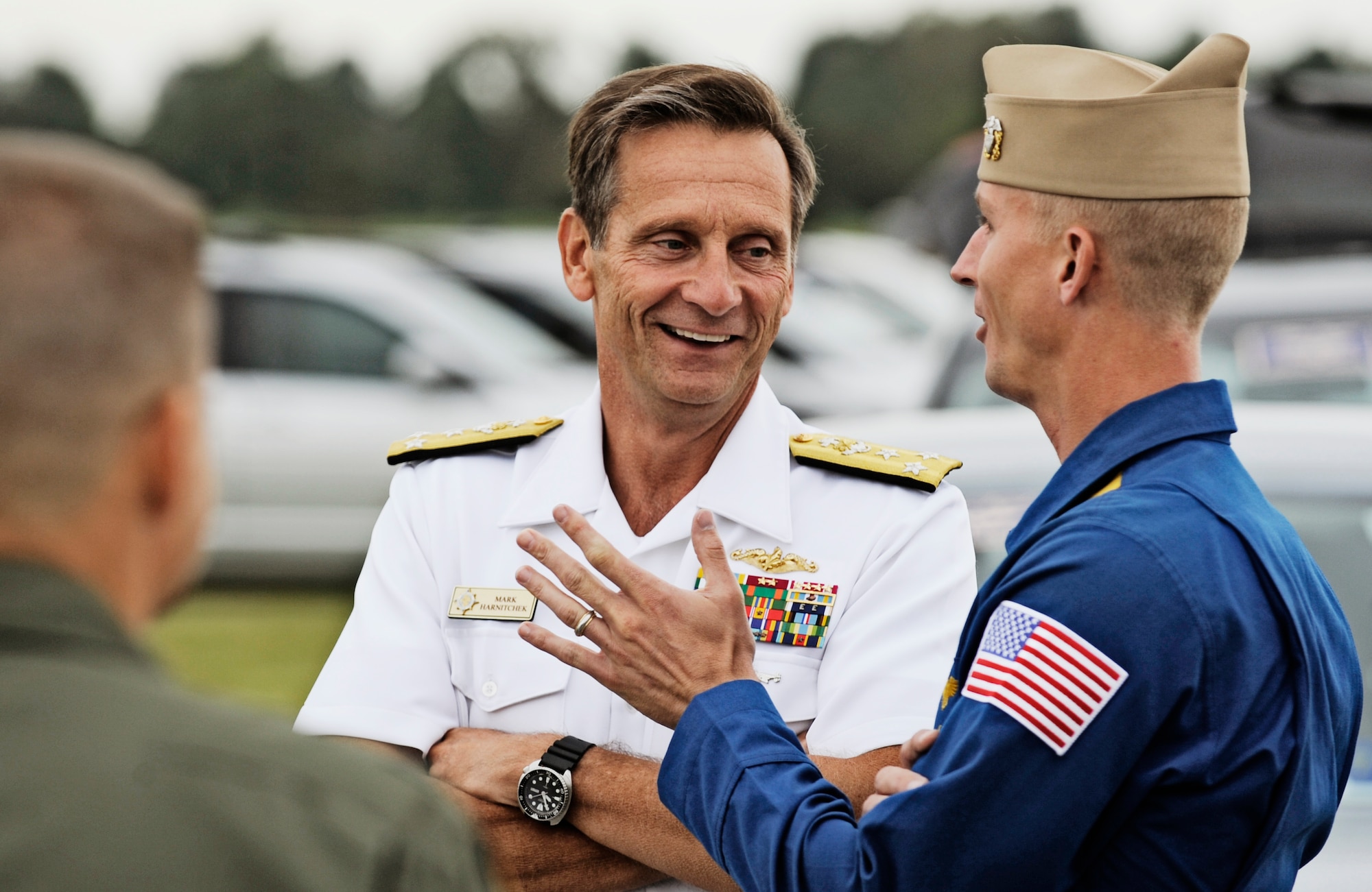 Vice Adm. Mark Harnitchek, deputy commander Unites States Transportation Command, speaks with Lt. C.J. Simonsen, #7 Blue Angel's pilot, about the upcoming air show at Scott Air Force Base, Sept. 9. Scott AFB is hosting the Airpower  Over the Midwest air show which is expected to draw nearly 90,000 people from the surrounding community during Saturday and Sunday's events. (U.S. Air Force photo/ Staff Sgt. Ryan Crane)