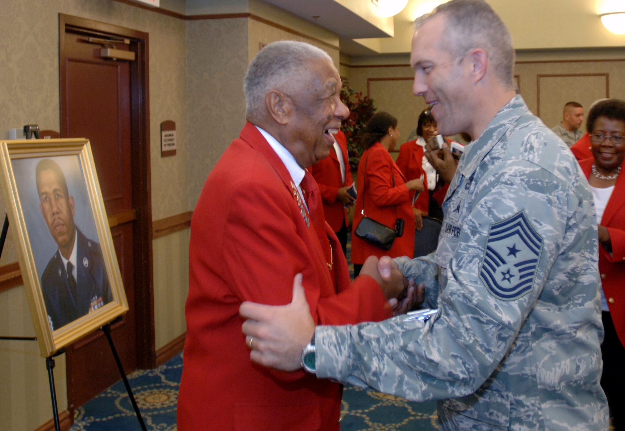 LANGLEY AIR FORCE BASE, Va. -- Retired Chief Master Sgt. Grant S. Williams, Sr., a Documented Original Tuskegee Airman, shares a laugh with Chief Master Sgt. Martin Klukas, Air Combat Command command chief, following his induction into the Langley Chief’s Room at the Bayside Enlisted Club Sept. 9. Williams is only the Chief’s Room’s second inductee, behind retired Chief Master Sgt. Bill Christie, that did not serve as Chief Master Sergeant of the Air Force. (U.S. Air Force photo/Airman 1st Class Jason J. Brown) (RELEASED)