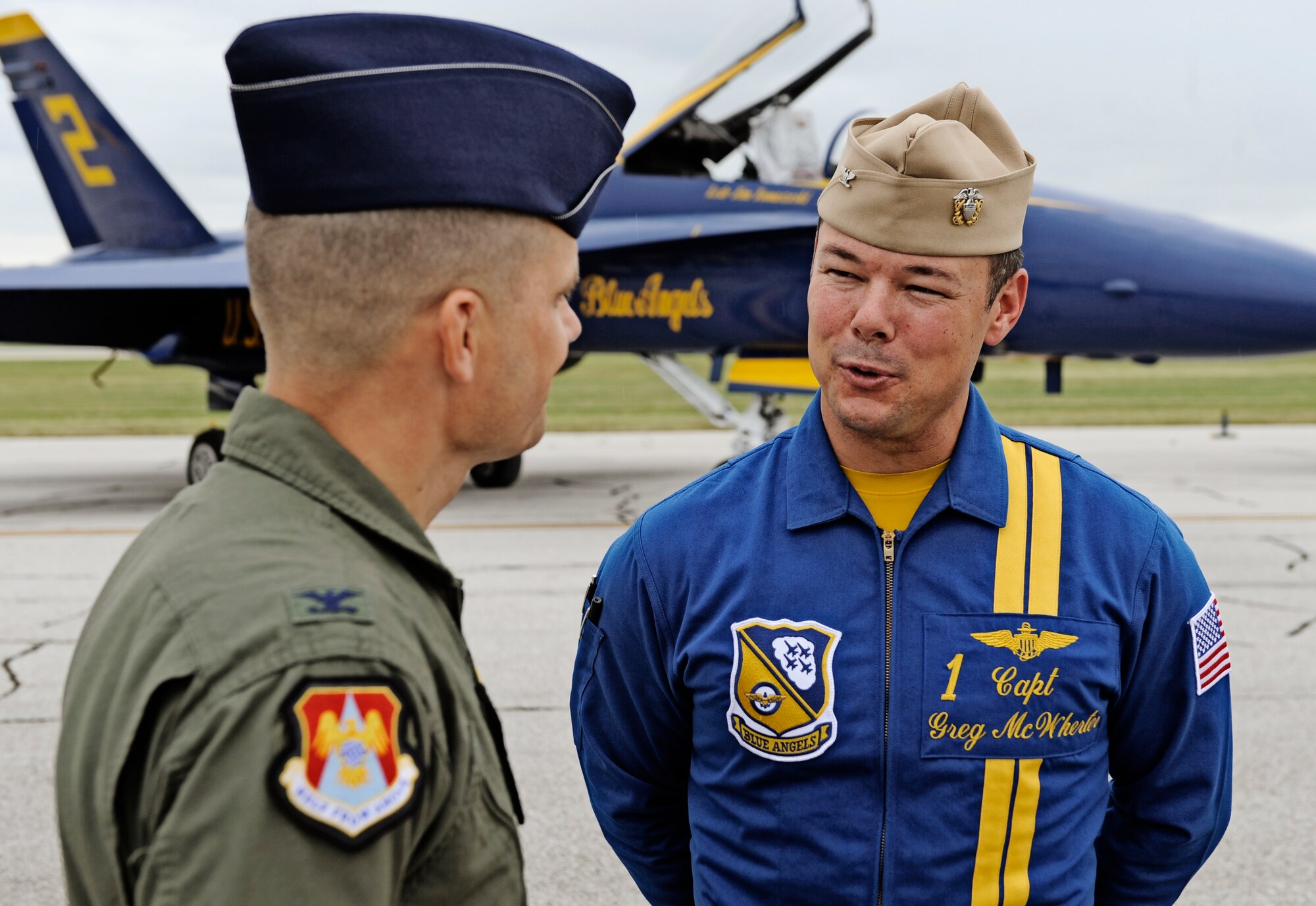 Col. Mike Hornitschek, 375th Air Mobility Wing commander, speaks on camera with Capt. Greg McWherter, Blue Angels flight leader, about his appreciation for what the Blue Angels provide to the community at Scott Air Force Base Sept. 9. Scott AFB is hosting the Airpower  Over the Midwest air show which is expected to draw nearly 90,000 people from the surrounding community during Saturday and Sunday's events. (U.S. Air Force photo/ Staff Sgt. Ryan Crane)