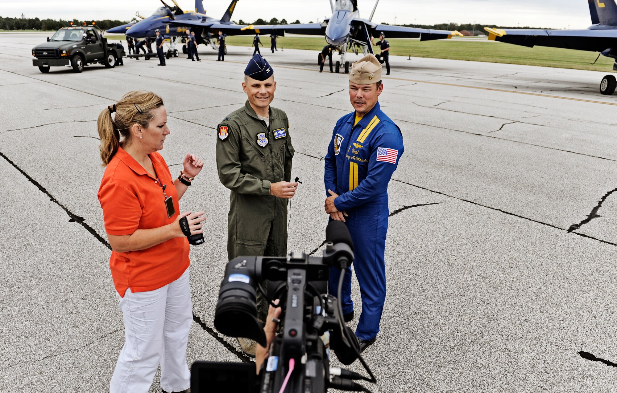 Col. Mike Hornitschek, 375th Air Mobility Wing commander, speaks on camera with Capt. Greg McWherter, Blue Angels flight leader, about his appreciation for what the Blue Angels provide to the community at Scott Air Force Base Sept. 9. Scott AFB is hosting the Airpower  Over the Midwest air show which is expected to draw nearly 90,000 people from the surrounding community during Saturday and Sunday's events. (U.S. Air Force photo/ Staff Sgt. Ryan Crane)