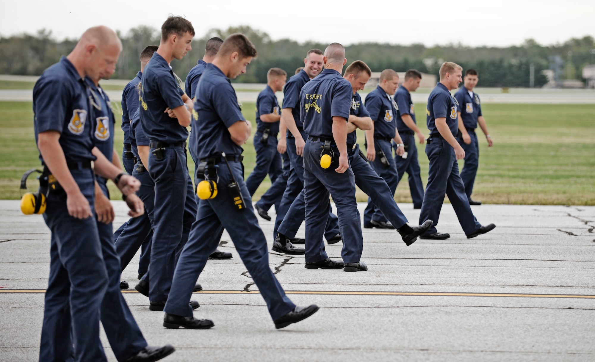 Maintainers, crew chiefs and personnel assigned to the Blue Angels perform a final inspection for debris on the flightline before the Blue Angel F/A-18's arrive to Scott Air Force Base Sept. 9. Scott AFB is hosting the Airpower  Over the Midwest air show which is expected to draw nearly 90,000 people from the surrounding community during Saturday and Sunday's events. (U.S. Air Force photo/ Staff Sgt. Ryan Crane)