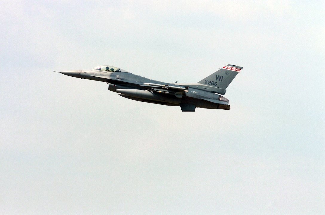 A Wisconsin Air National Guard F-16 Fighting Falcon fighter aircraft, 176th Fighter Squadron, 115th Fighter Wing, Truax Field, Wis., flies over Volk Field during Patriot 05. Patriot 05 is the largest annual exercise held across the United States. This exercise increases the war fighting capabilities of the National Guard, Reserve, and active components of the Air Force and Army. Additionally, Canadian, United Kingdom, and Dutch forces are participating, increasing combined effectiveness. (U.S. Air Force photo by Tech Sgt. Brian E. Christiansen) (Released) 