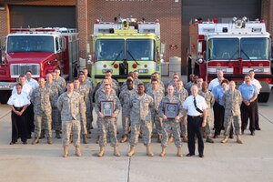 LANGLEY AIR FORCE BASE, Va. -- Members of the 633d Civil Engineer Squadron Langley Fire Emergency Services team pose for a group photo in front of the Langley Fire Department Sept. 8. The Commission on Fire Accreditation International recognized Langley Fire Emergency Services as a fully accredited Fire Emergency Services Organization during the Fire-Rescue International and Department of Defense Fire Emergency Services Conference in Chicago Aug. 25, a first for Air Combat Command. (U.S. Air Force courtesy photo) (RELEASED)