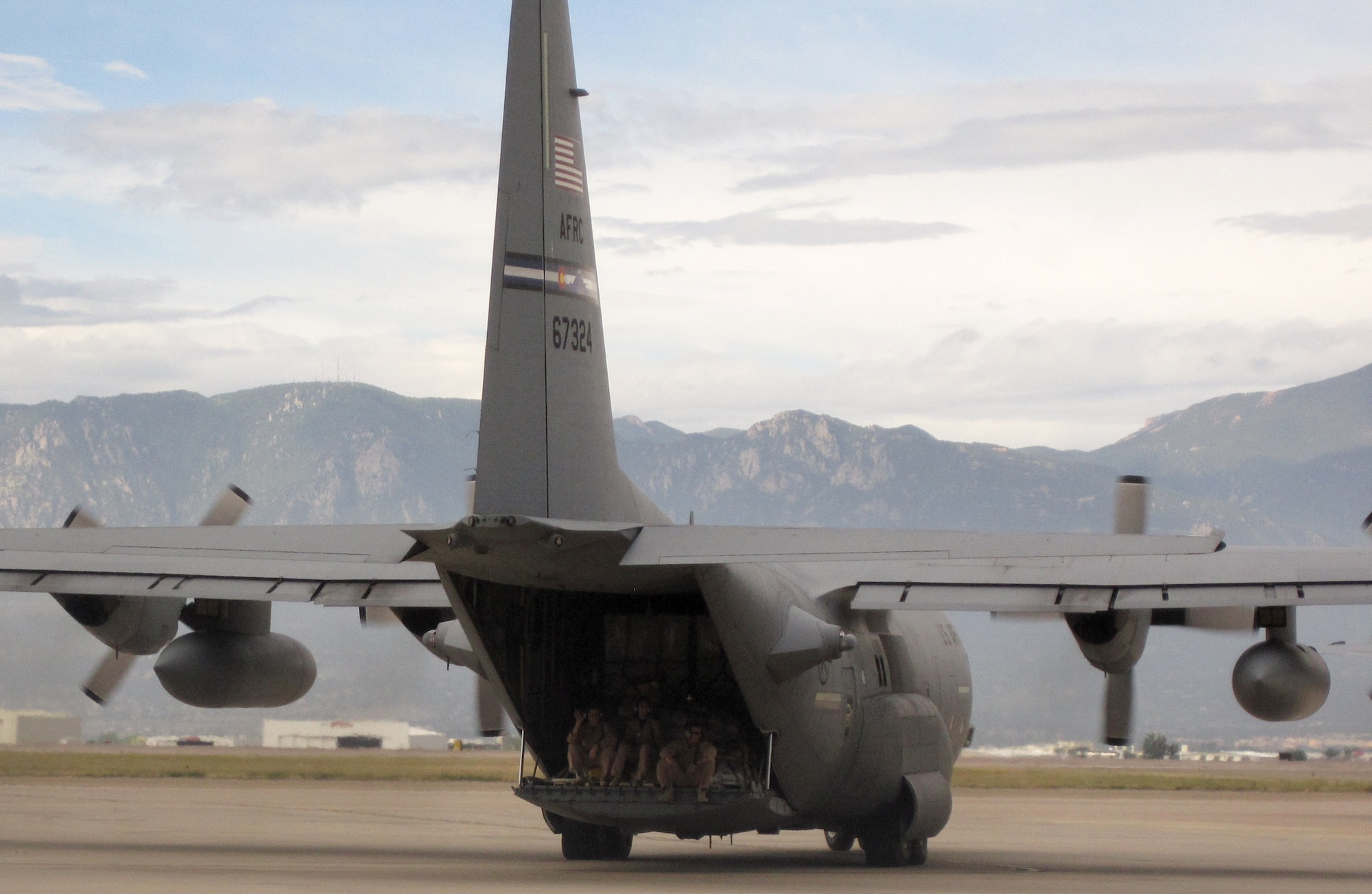 Members of the Air Force Reserve's 302nd Airlift Wing get one last look at home Sept. 8 as they deployed to the Middle East from Peterson Air Force Base, Colo. Approximately 50 302nd AW members deployed in support of U.S. Central Command operations Sept. 8, while additional aircrew, maintenance and support AF Reservists deployed Sept. 9. Approximately 150 members deployed in all. The AF Reserve's 302nd AW is based at this southern Colorado installation. (U.S. Air Force photo/1st Lt. Holly Cookson)