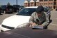 LANGLEY AIR FORCE BASE, Va. -- Airman 1st Class Kathy Shih, 633d Security Forces Squadron patrol, prepares a citation for an abandoned vehicle at the Langley Airman dormitories Sept. 9. The 633d SFS will ticket illegally parked vehicles base-wide during Operation Clean Sweep Sept. 29-30. Owners of ticketed vehicles will have 72 hours following the citation to move the vehicle or face the expense and inconvenience of towing and impoundment. (U.S. Air Force photo/Airman 1st Class Jason J. Brown) (RELEASED)