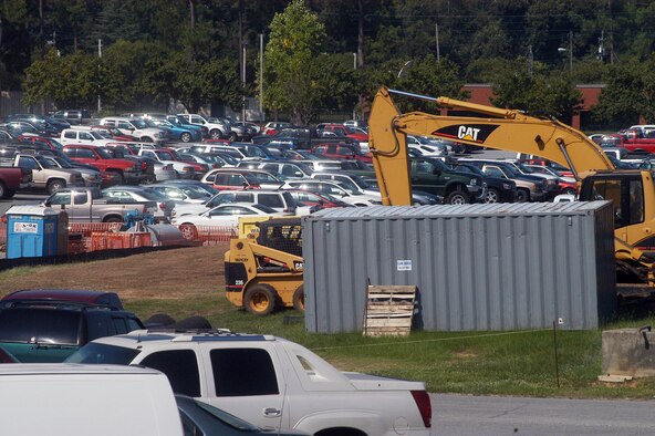 Building projects take up a number of parking spaces for equipment and material during construction. U. S. Air Force photo by Sue Sapp
