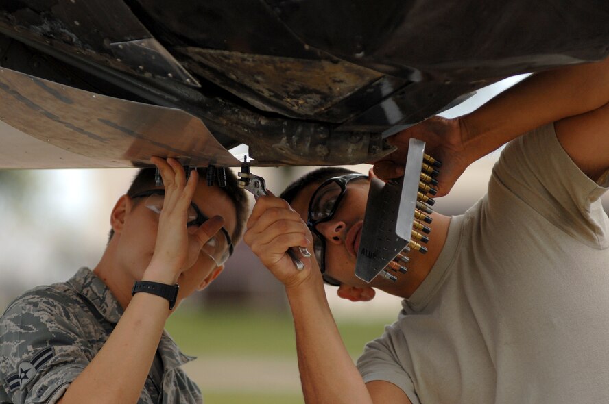 Senior Airman Jonathan Cooper and Airman 1st Class John Ezell, 131st Maintenance Squadron, drill holes in preparation of mounting metal onto a B-47 Stratojet static display aircraft, Wednesday. The 131st and 509th maintenance Airmen spent the last few days performing routine maintenance to keep the 70 plus year-old aircraft in mint condition. (U.S. Air Force photo Senior Airman Kenny Holston)(Released)

