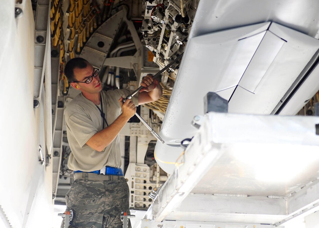 Staff Sgt. Cedric DeBourbon makes final adjustments prior to loading AGM-158 Joint Air-to-Surface Stand-off Missles onto a B-1B Lancer Sept. 7, 2010, at Dyess Air Force Base, Texas. 7. JASSMs are designed to keep the jet and its crew a significant distance away from surface-to-air threats while still holding an enemy's targets at risk. Sergeant DeBourbon is assigned to the 7th Airlift Maintenance Squadron. (U.S. Air Force photo/Airman 1st Class Brittney Smolinski) 