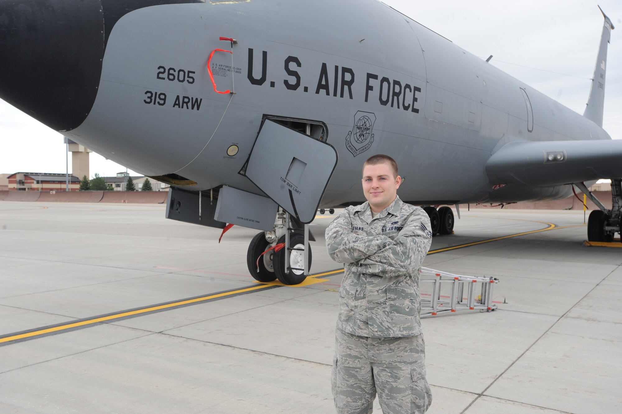 Senior Airman Christopher “Aaron” Evans, 319th Aircraft Maintenance Squadron, poses for a photo in front of a KC-135 Stratotanker Sept. 9 on Grand Forks Air Force Base, N.D. (U.S. Air Force photo by Staff Sgt. Suellyn Nuckolls)