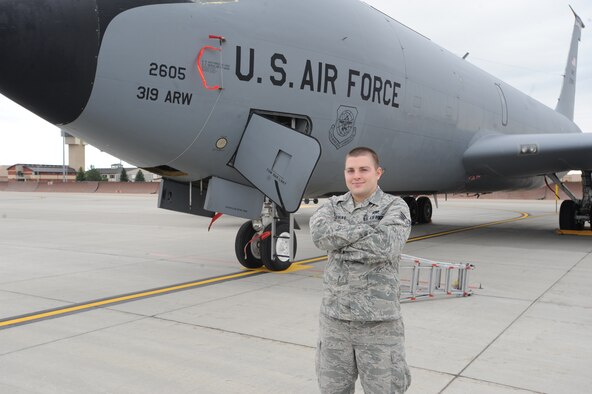 Senior Airman Christopher “Aaron” Evans, 319th Aircraft Maintenance Squadron, poses for a photo in front of a KC-135 Stratotanker Sept. 9 on Grand Forks Air Force Base, N.D. (U.S. Air Force photo by Staff Sgt. Suellyn Nuckolls)