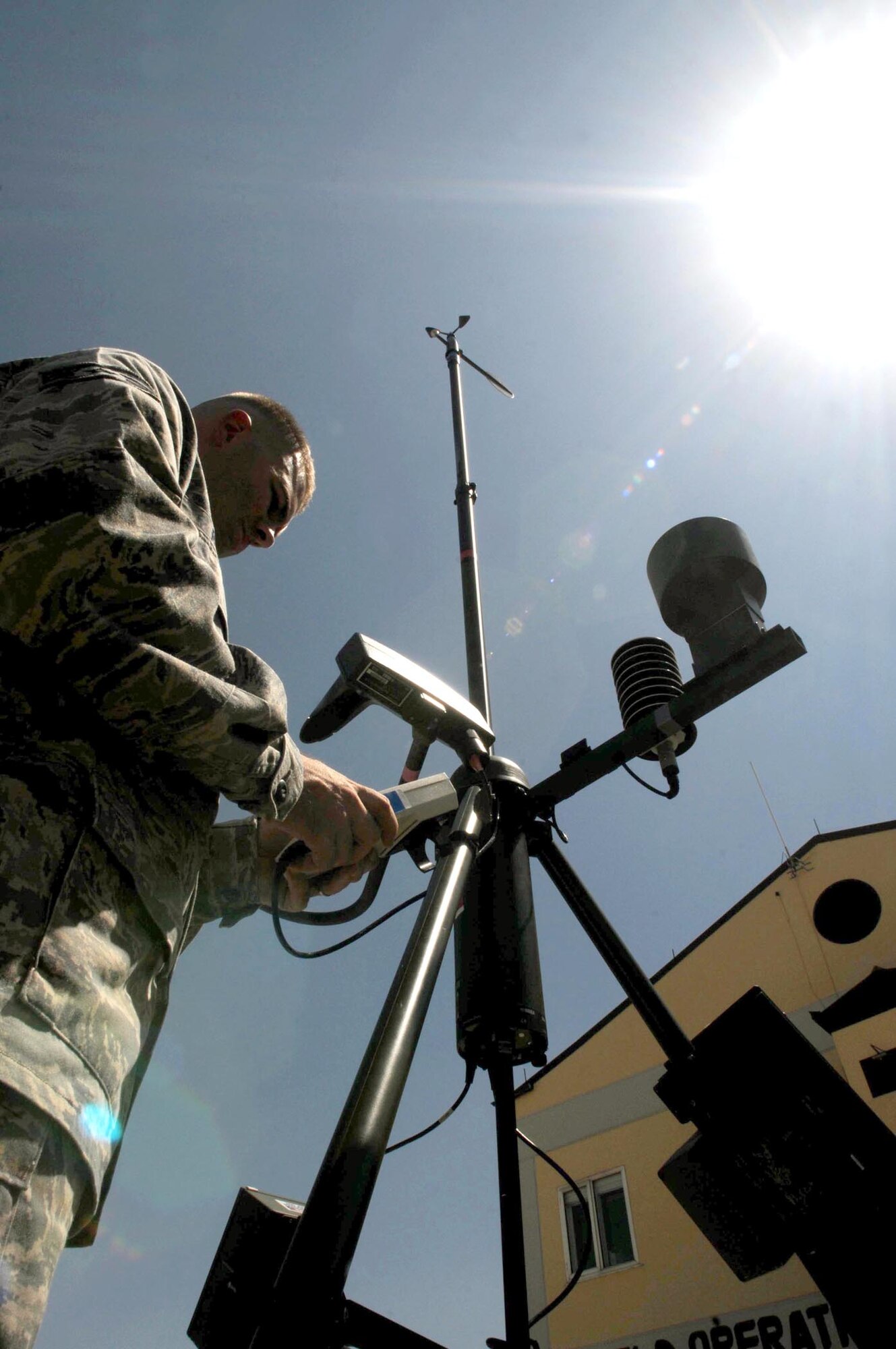 Staff Sgt. Jeffrey Robbins measures wind direction with a handheld monitor on a Tactical Meteorological Observing System Aug. 25, 2010, at Incirlik Air Base, Turkey. The TMOS is a tactical, deployable weather sensing device used to collect real-time weather data from austere locations, forward operating bases and remote sites. Sergeant Robbins is a weather technician assigned to the 39th Operations Squadron. (U.S. Air Force photo/Senior Airman Ashley Wood) 