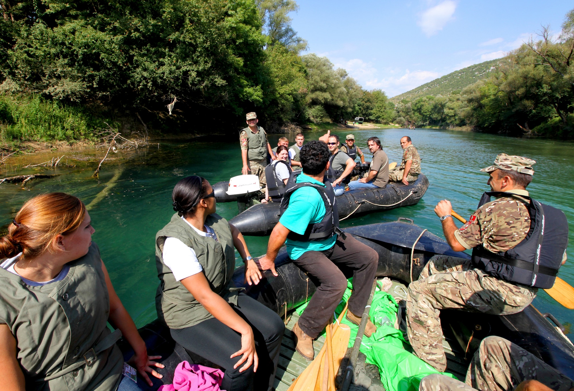 U.S. and Montenegrin forces prepare to gather fallen branches and stray garbage during a river clean up Sept. 8, 2010, outside Danilovgrad, Montenegro, as part of Medical Training Exercise in Central and Eastern Europe 2010. MEDCEUR 2010 brings together nine central and eastern European nations for a series of joint activities meant to improve medical mass casualty operation, planning and coordination skills. (U.S. Marine Corp photo/Lance Cpl. Jad Sleiman)