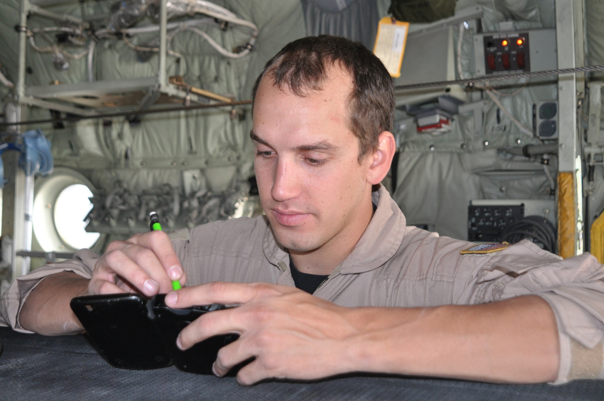 Senior Airman Michael Minnillo electronically logs weight and balance verifications for a C-130 Hercules Sept. 8 prior to deploying to the Middle East at Peterson Air Force Base, Colo. Airman Minnillo, a C-130 loadmaster assigned to the 731st Airlift Squadron, was one of approximately 50 Air Force Reservists who deployed from the Air Force Reserve's 302nd Airlift Wing in support of U.S. Central Command operations. Approximately 150 aircrew, maintenance and support AF Reservists from the 302nd AW will departy for deployment through Sept. 9. The 302nd AW is based at this southern Colorado installation. (U.S. Air Force photo/Staff Sgt. Stephen J. Collier)