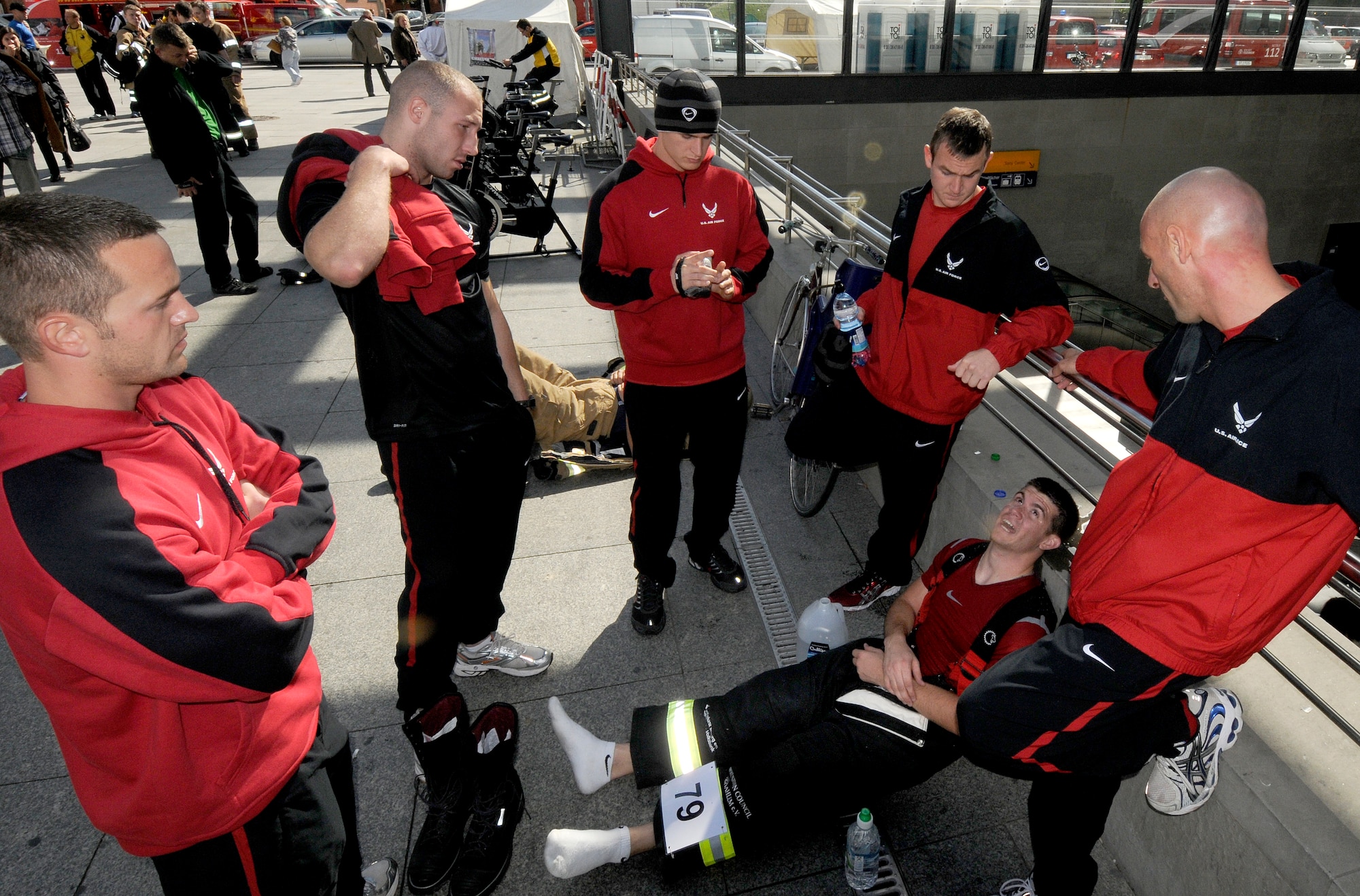 BERLIN – Firefighters from Team Spangdahlem discuss strategy for their upcoming relay during the fourth Berlin Firefighter Combat Challenge Sept. 3. The firefighters competed against 15 other relay teams and more than 230 individual competitors from seven countries. (U.S. Air Force photo/Staff Sgt. Benjamin Wilson)