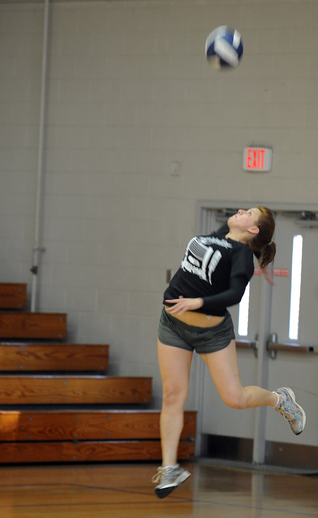 Airman 1st Class Sebastiana Solis Lopez leaps upward to serve during the Joint Base Charleston intramural volleyball championship game between the 437th Aircraft Maintenance Squadron and the 628th Civil Engineer Squadron at the Fitness and Sports Center Sept. 8, 2010, on Joint Base Charleston, S.C. Eleven teams competed for the title of intramural volleyball champions, a total of 110 games were played, with only two teams left to compete for the trophy, 437th AMXS and 628th CES. Airman Solis Lopez is a crew chief with the 437th Aircraft Maintenance Squadron. (U.S. Air Force photo/Senior Airman Timothy Taylor)
