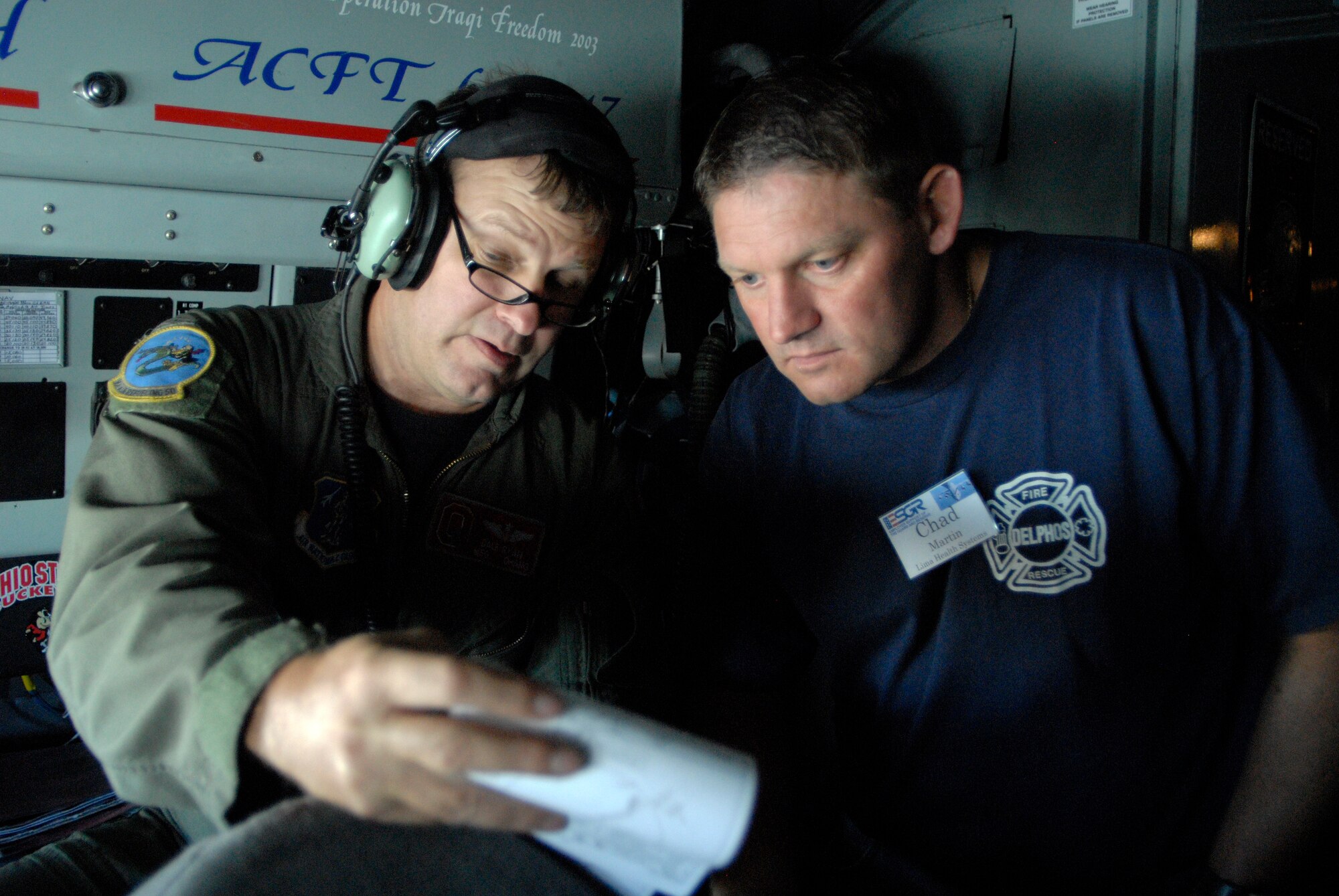 WRIGHT-PATTERSON AIR FORCE BASE, Ohio – Master Sgt. Dale Ryan, talks to Mr. Chad Martin, Lima Memorial Health Systems, on the flight deck of a KC-135 Stratotanker belonging to the 121st Air Refueling Wing, Rickenbacker Air National Guard Base, Ohio, during an ESGR Boss-Lift flight Aug. 12. (U.S. Air Force photo/Maj. Jose Cardenas)