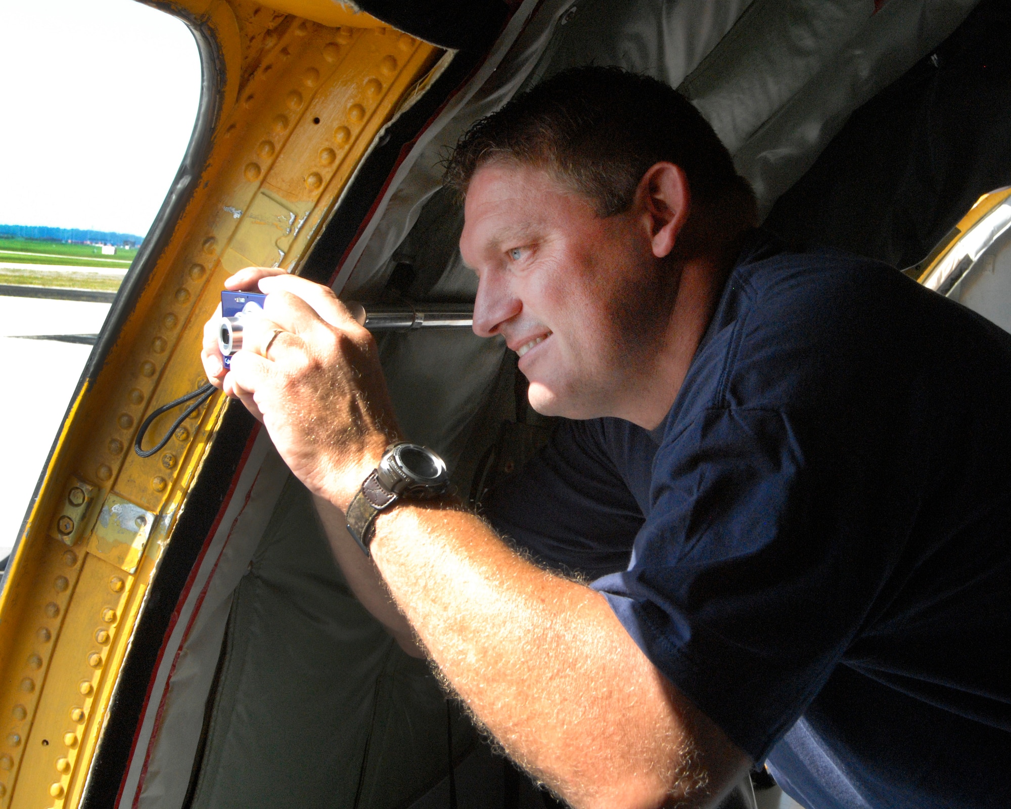 WRIGHT-PATTERSON AIR FORCE BASE, Ohio – Mr. Chad Martin, Lima Memorial Health Systems, takes a photo prior to take-off from a KC-135 Stratotanker belonging to the 121st Air Refueling Wing, Rickenbacker Air National Guard Base, Ohio, for an ESGR Boss-Lift flight Aug. 12. (U.S. Air Force photo/Maj. Jose Cardenas)