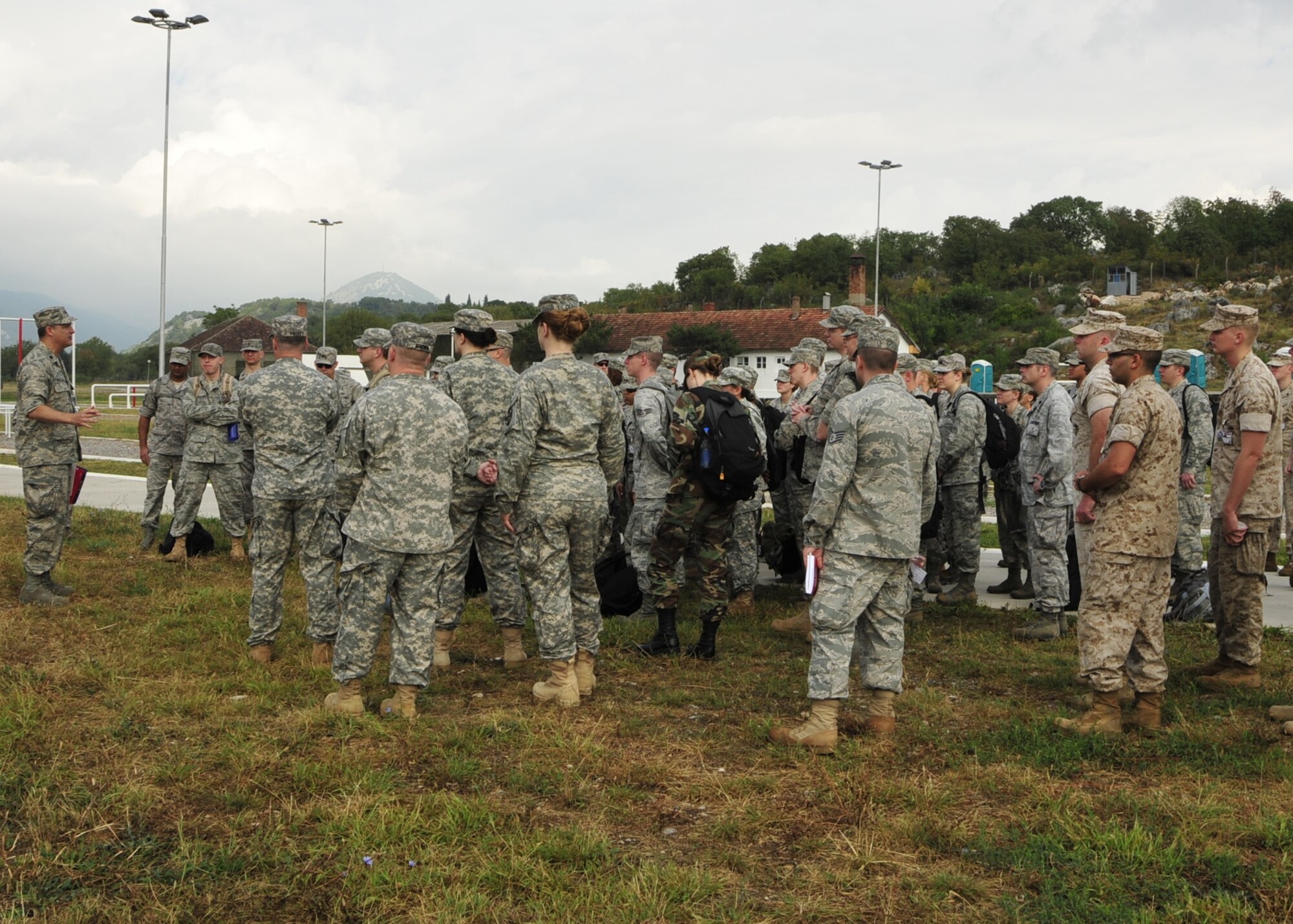Lt. Col. Brent Vosseller, MEDCEUR 2010 exercise commander, briefs U.S. Air Force, Army, and Marine Corps members on ways to show consideration for other services Sept. 9 on Danilovgrad Army Base, Montenegro. Military members from the U.S. and nine other nations are here to work together during MEDCEUR, a medical training exercise in central and eastern Europe. For more information, visit www.usafe.af.mil/medceur.asp and www.odbrana.gov.me. (U.S. Air Force photo/Airman 1st Class Tiffany Deuel)