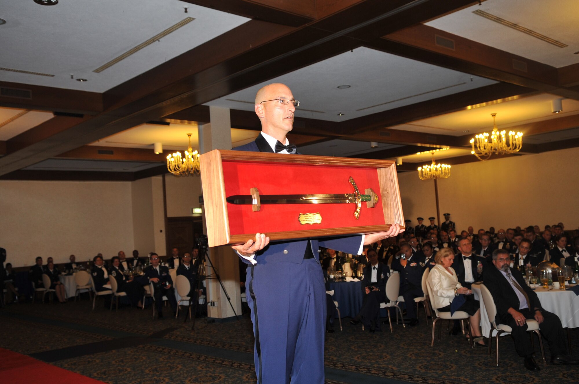 U.S. Air Force Chief Master Sgt. Mitchell Stippel, 435th Air Ground Operations Wing command chief, presents the Order of the Sword to Gen. Roger A. Brady, U.S. Air Forces in Europe commander, Ramstein Air Base, Germany, Sept. 8, 2010. As the 19th recipient of USAFE's Order of the Sword, General Brady was given the highest honor someone can receive from the Air Force's enlisted corps. (U.S. Air Force photo by Airman 1st Class Desiree Esposito)
