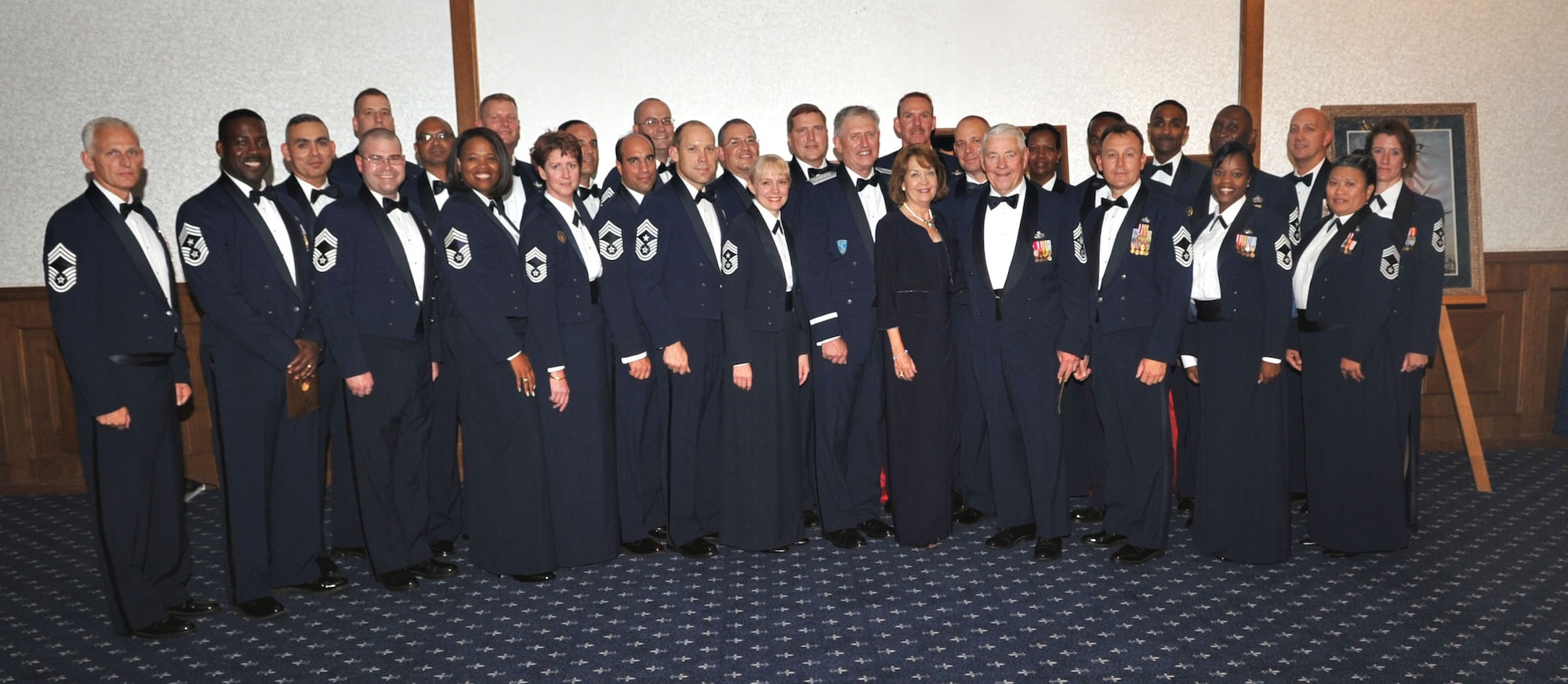 Gen. Roger A. Brady, U.S. Air Forces in Europe commander, and his wife, Litha Brady, take a group photo with USAFE chiefs after the Order of the Sword ceremony, Ramstein Air Base, Germany, Sept. 8, 2010. As the 19th recipient of USAFE's Order of the Sword, General Brady was given the highest honor someone can receive from the Air Force's enlisted corps. (U.S. Air Force photo by Airman 1st Class Desiree Esposito)
