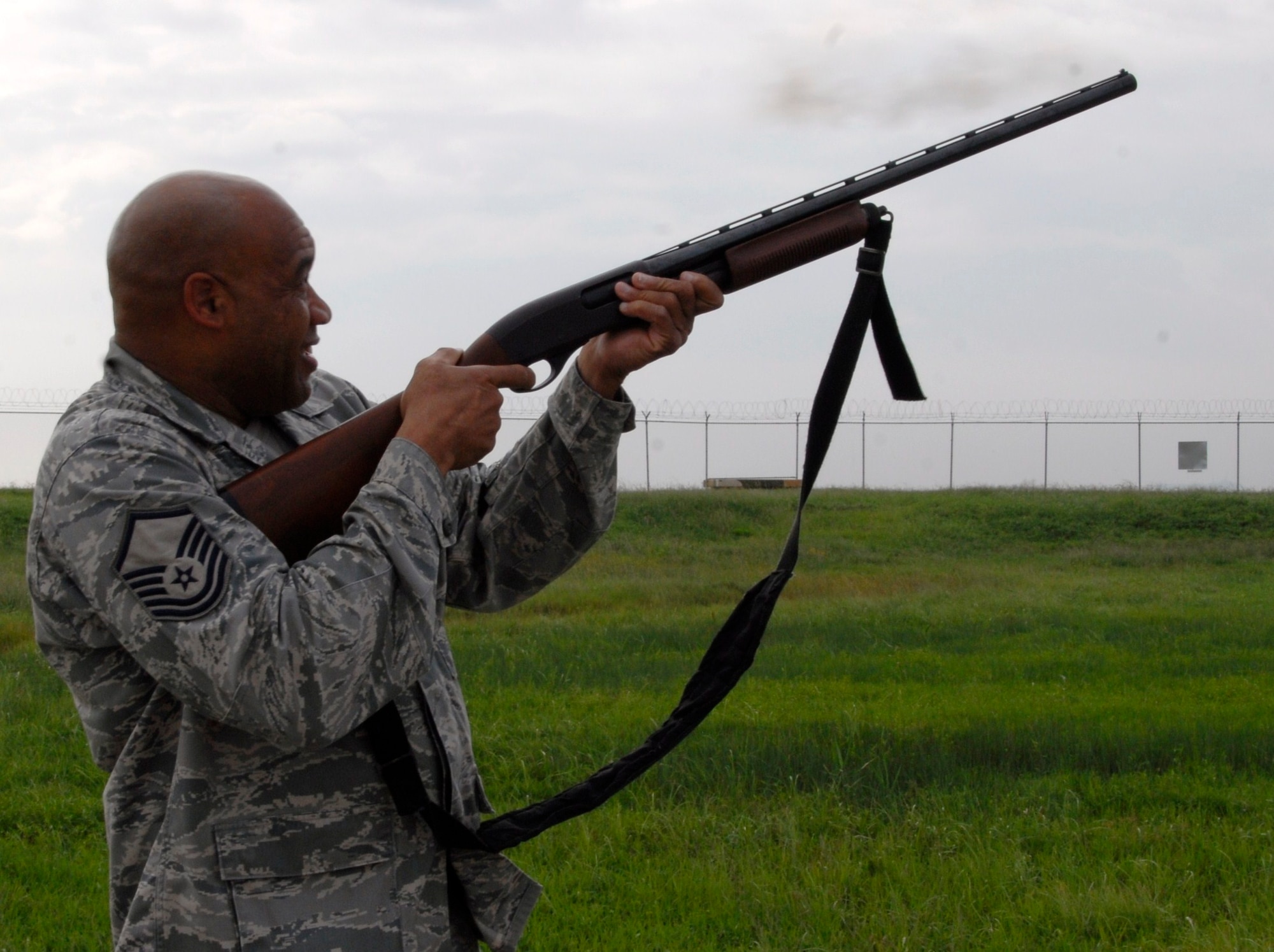 KUNSAN AIR BASE, Republic of Korea -- Master Sgt. William Carson, 8th Fighter Wing flight safety, fires a shotgun to scare off birds on the flightline. Flight safety is responsible for the Kunsan Bird Aircraft Strike Hazard, or BASH, management program. (U.S. Air Force photo/Staff Sgt. Amanda Savannah)