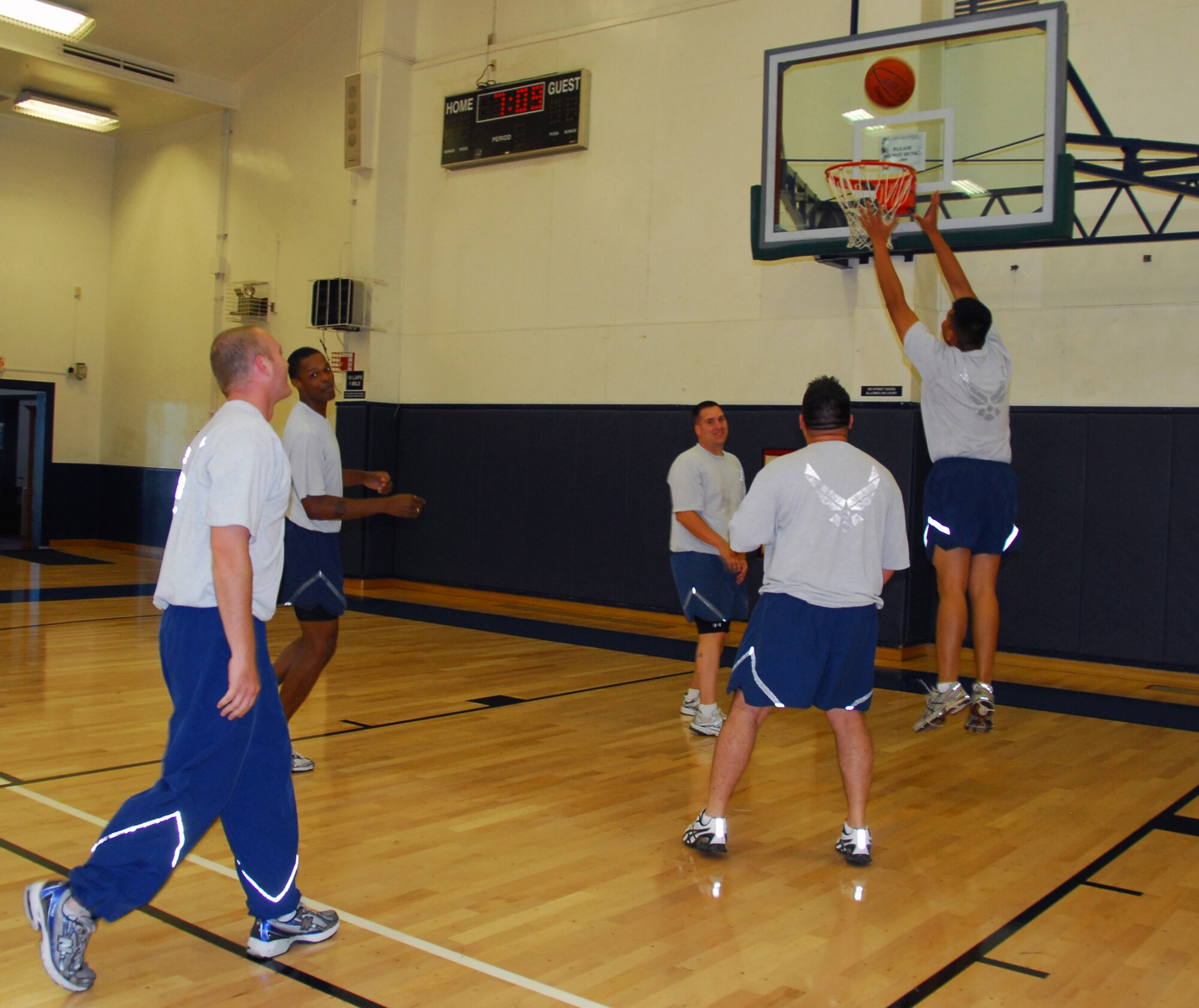 Members of the Air Force 373rd Support Squadron at Misawa Air Base, Japan, play basketball at a fitness center here, Sept. 9, 2010. The squadron participates in various exercises to keep healthy and stay in shape. By participating in the President’s Fitness Challenge, teams can include playing basketball as their daily physical activity. (U.S. Air Force photo by 1st Lt. Cammie Quinn/Released)