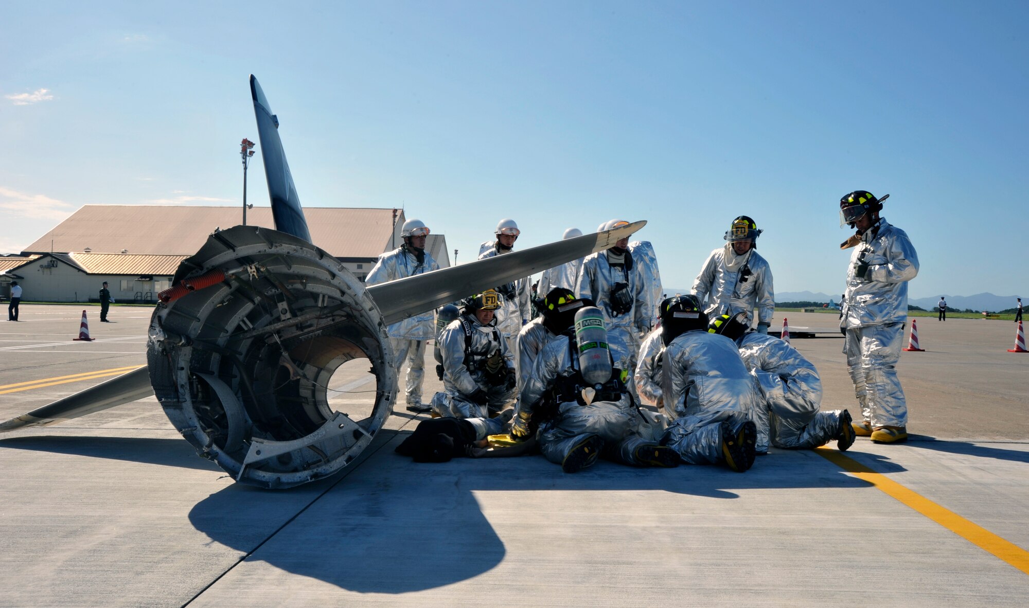 35th Civil Engineer Squadron members, simulate rescuing victims during a major accident response exercise at Misawa Air Base, Japan, Sept. 8, 2010. Misawa AB and Japan Air Self-Defense Force combined rescue efforts as part of a joint exercise, which was geared to prepare the base in the event of a mishap during the Misawa Air Festival scheduled Sept. 19. (U.S. Air Force photo/Tech. Sgt. Russell McBride/Released)
