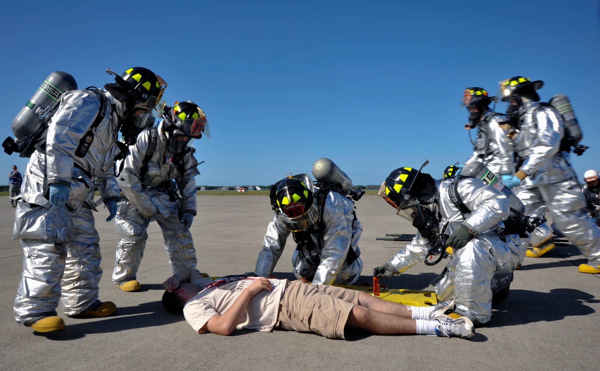 Air Force 35th Civil Engineer Squadron members, simulate rescuing victims during a major accident response exercise at Misawa Air Base, Japan, Sept. 8, 2010. Misawa AB and Japan Air Self-Defense Force combined rescue efforts as part of a joint exercise, which was geared to prepare the base in the event of a mishap during the Misawa Air Festival scheduled Sept. 19. (U.S. Air Force photo/Tech. Sgt. Russell McBride/Released)