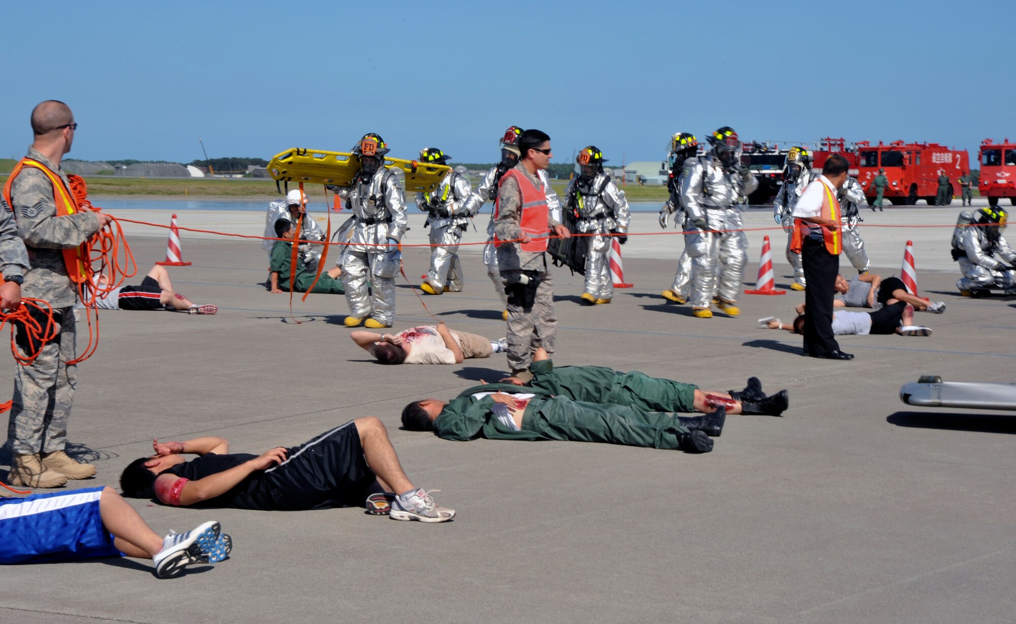 Members 35th Civil Engineer Squadron, simulate rescuing victims during a major accident response exercise at Misawa Air Base, Japan, Sept. 8, 2010. Misawa AB and Japan Air Self-Defense Force combined rescue efforts as part of a joint exercise, which was geared to prepare the base in the event of a mishap during the Misawa Air Festival scheduled Sept. 19. (U.S. Air Force photo/Tech. Sgt. Russell McBride/Released)