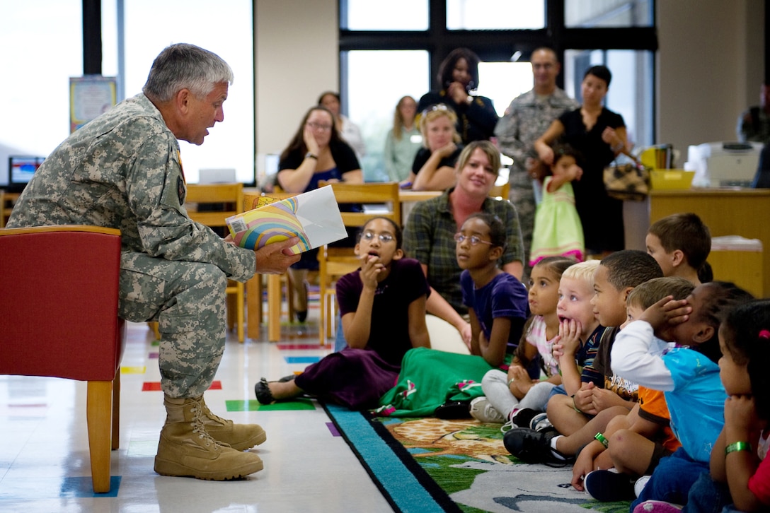 Gen. George W. Casey Jr., Army chief of staff, reads the Dr. Seuss book, "Oh the Places You Will Go," to a group of small children after he helped cut the ribbon on the new "Magical World of Discovery" children's reading room at the Casey Memorial Library on Fort Hood, Texas. The library is named for the general's late father. 