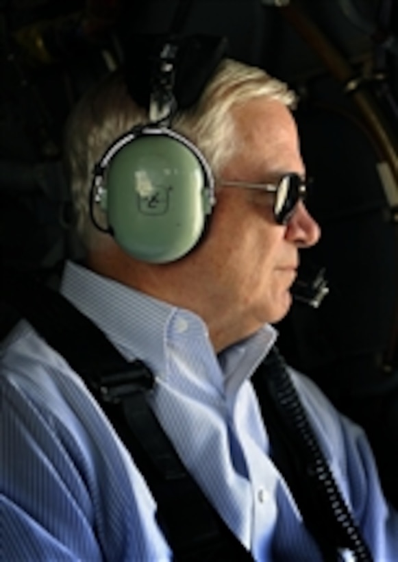 Secretary of Defense Robert M. Gates gazes out the window as he flies from Kandahar Airfield, Afghanistan, to Camp Nathan Smith, Afghanistan, in a U.S. Army UH-60 Black Hawk helicopter on Sept. 3, 2010.  