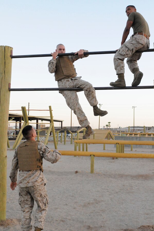 Marine Attack Squadron 214 Marines tackle the obstacle course during their Marine Corps Martial Arts Program gray belt training at the Marine Corps Air Station in Yuma, Ariz., Sept. 9, 2010. It builds cohesion among Marines, which is important to understand, especially on the battlefield, said Cpl. Daniel Keil, MCMAP instructor. Created in 2001, MCMAP offers Marines a chance to increase their physical endurance and hand-to-hand combat proficiency with various belt levels.
