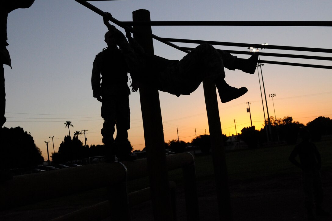A Marine Attack Squadron 214 Marine swings onto, and through the bar portion of the obstacle course as part of Marine Corps Martial Arts Program gray belt training at the Marine Corps Air Station in Yuma, Ariz., Sept. 9, 2010. It builds cohesion among Marines, which is important to understand, especially on the battlefield, said Cpl. Daniel Keil, MCMAP instructor. Created in 2001, MCMAP offers Marines a chance to increase their physical endurance and hand-to-hand combat proficiency with various belt levels.