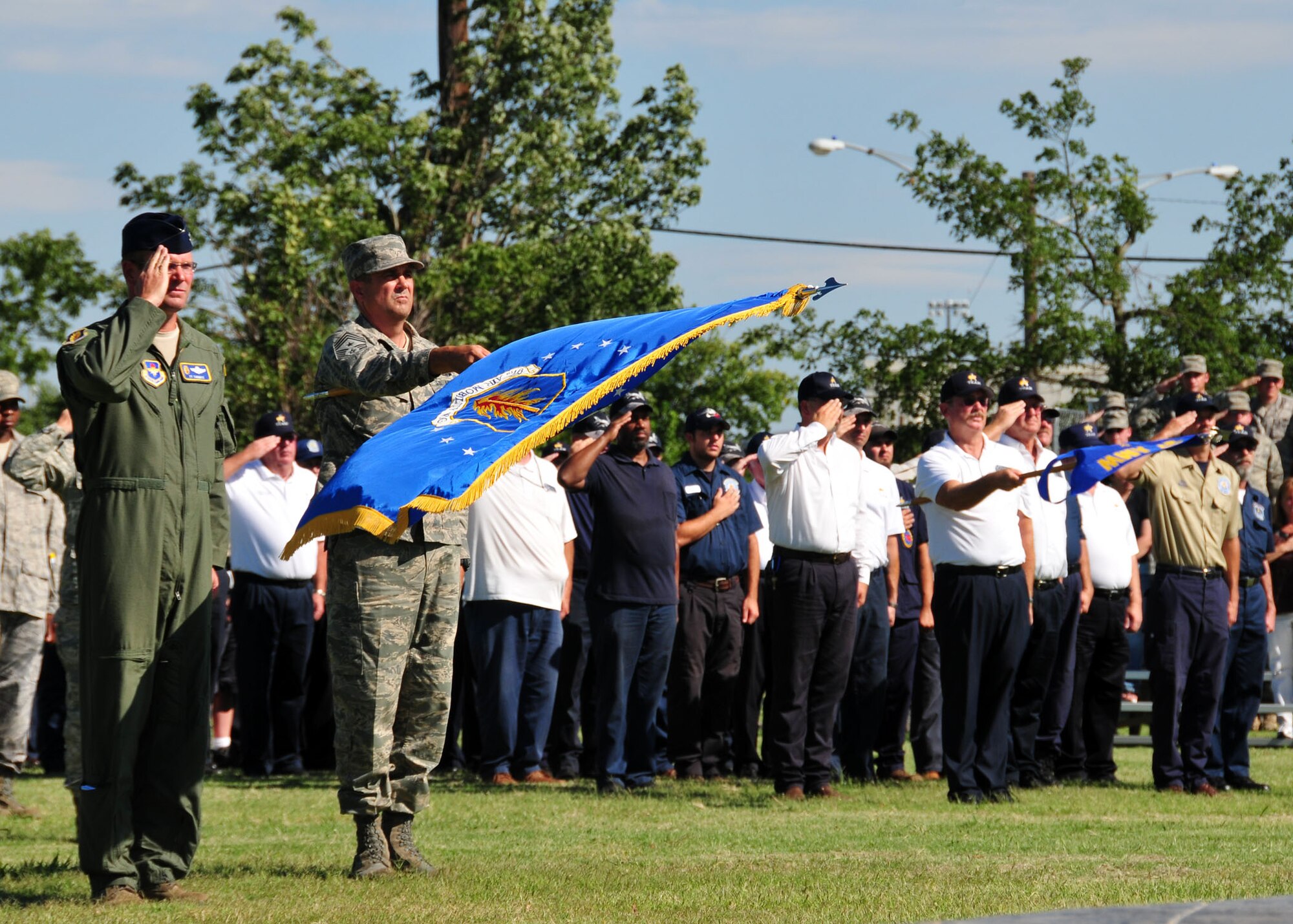 ALTUS AIR FORCE BASE, Okla. -- Col. Ty Thomas, 97th Air Mobility Wing commander and Chief Master Sgt. Robert Austin, 97th Command Chief, stand in formation and salute as a new flag is raised during a September 11th memorial ceremony and formation at the Wings of Freedom Park on 10 Sept. (U.S. Air Force photo by Master Sgt. Brian M. Boisvert/ Released 97th Air Mobility Wing Public Affairs)