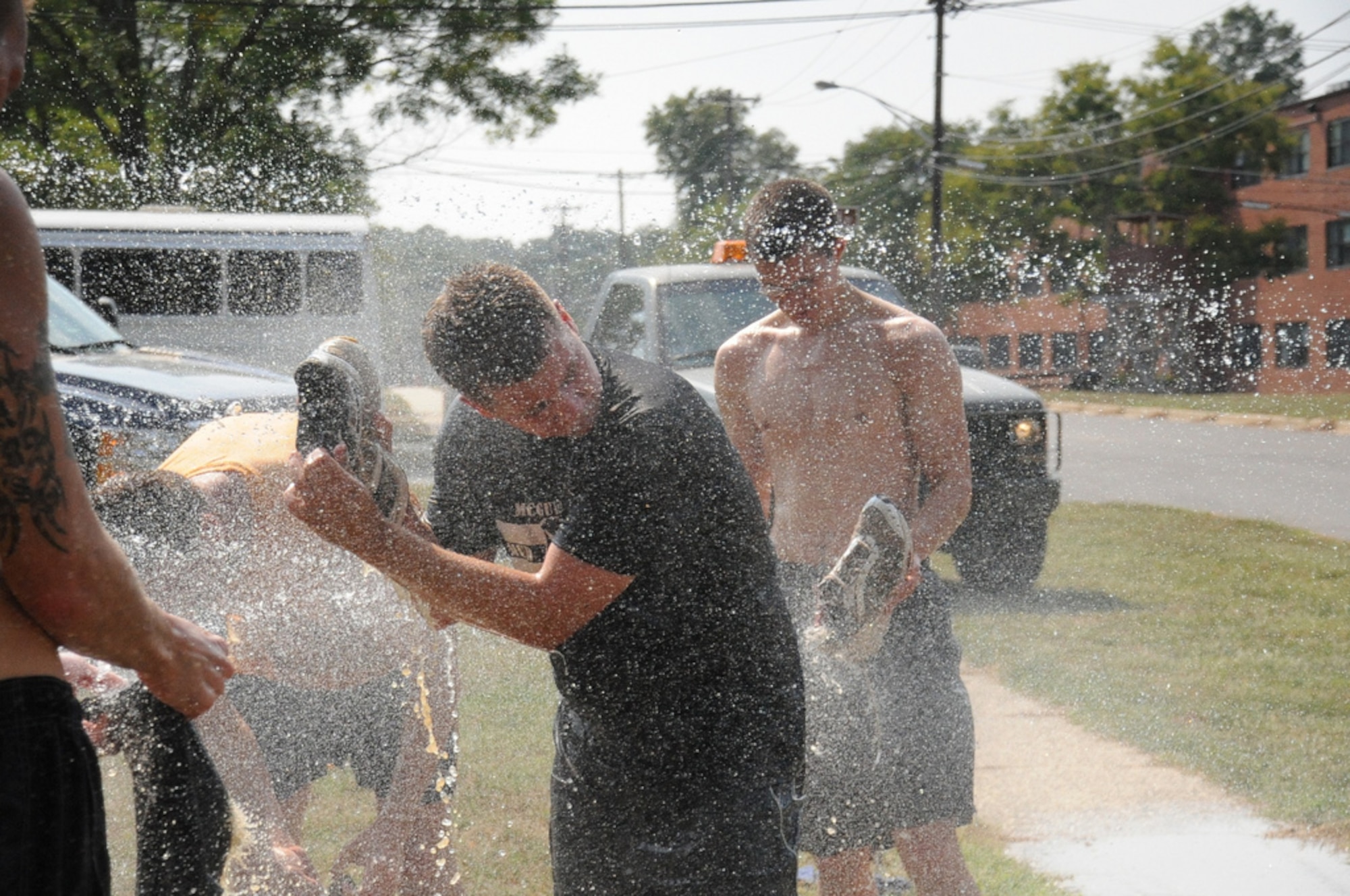 Master Sgt. Robert Grant, 305th Aircraft Maintenance Squadron, rinses mud from his shoes after a test run of the expanded course for this year’s “Beast of the East” McGuire Mud Run. The 10K run, which features both man-made and natural obstacles and is open to the public, is set to begin Saturday at 9 a.m. More than 2,000 participants are registered for this year’s run. (U.S. Air Force photo/Staff Sgt. Danielle Johnson)