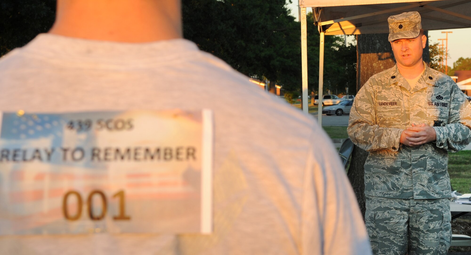 LANGLEY AIR FORCE BASE, Va – Lt. Col. Marc Vandeveer, 633d Civil Engineer Squadron commander, shares his experiences from 9/11 with Joint Base Langley-Eustis runners during a motivational start to the memorial run on Sept. 10, 2010. This event was intended to bring awareness, and respect to our brothers and sisters who paid the ultimate price. (U.S. Air Force photo/Staff Sgt. Tabitha Kuykendall)(RELEASED)