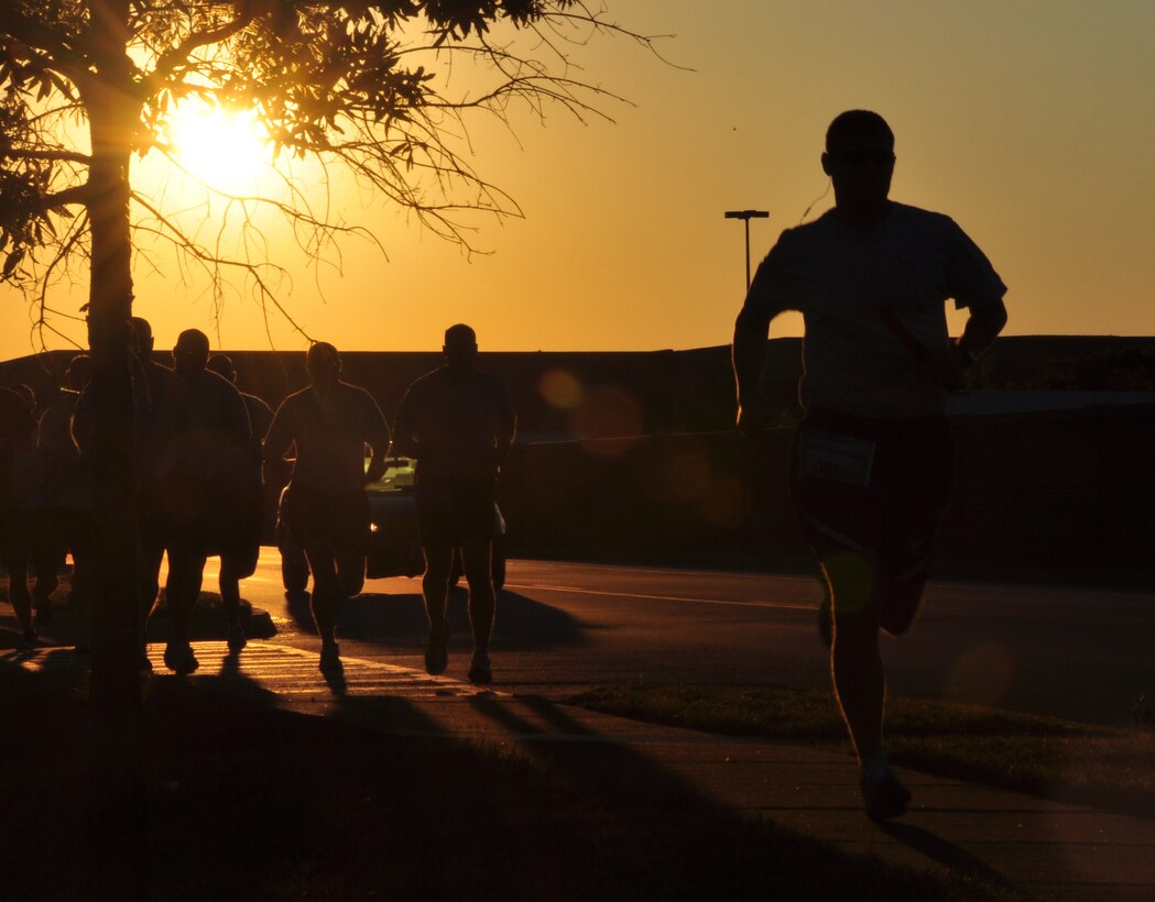 LANGLEY AIR FORCE BASE, Va – Joint Base Langley-Eustis runners take off at the start of a 9/11 memorial run Sept. 10, 2010. 633d Civil Engineer Squadron hosted the run in memoriam of the 55 military personnel that gave their lives on Sept. 11.  Ten teams, each consisting of 11 people, ran a total of 550 miles with each member running a five-mile loop. (U.S. Air Force photo/Senior Airman Jonathan Muller)(RELEASED)