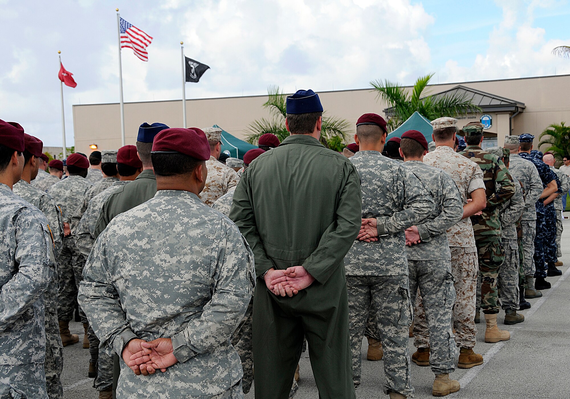 Members of Special Operations Command South, U.S. Coast Guard and the 482nd Fighter Wing stand in formation to pay respect and honor the victims of 9/11 during a memorial service held outside SOCSOUTH headquarters at Homestead Air Reserve Base, Fla., Sept. 10. (U.S. Air Force photo/Tim Norton)