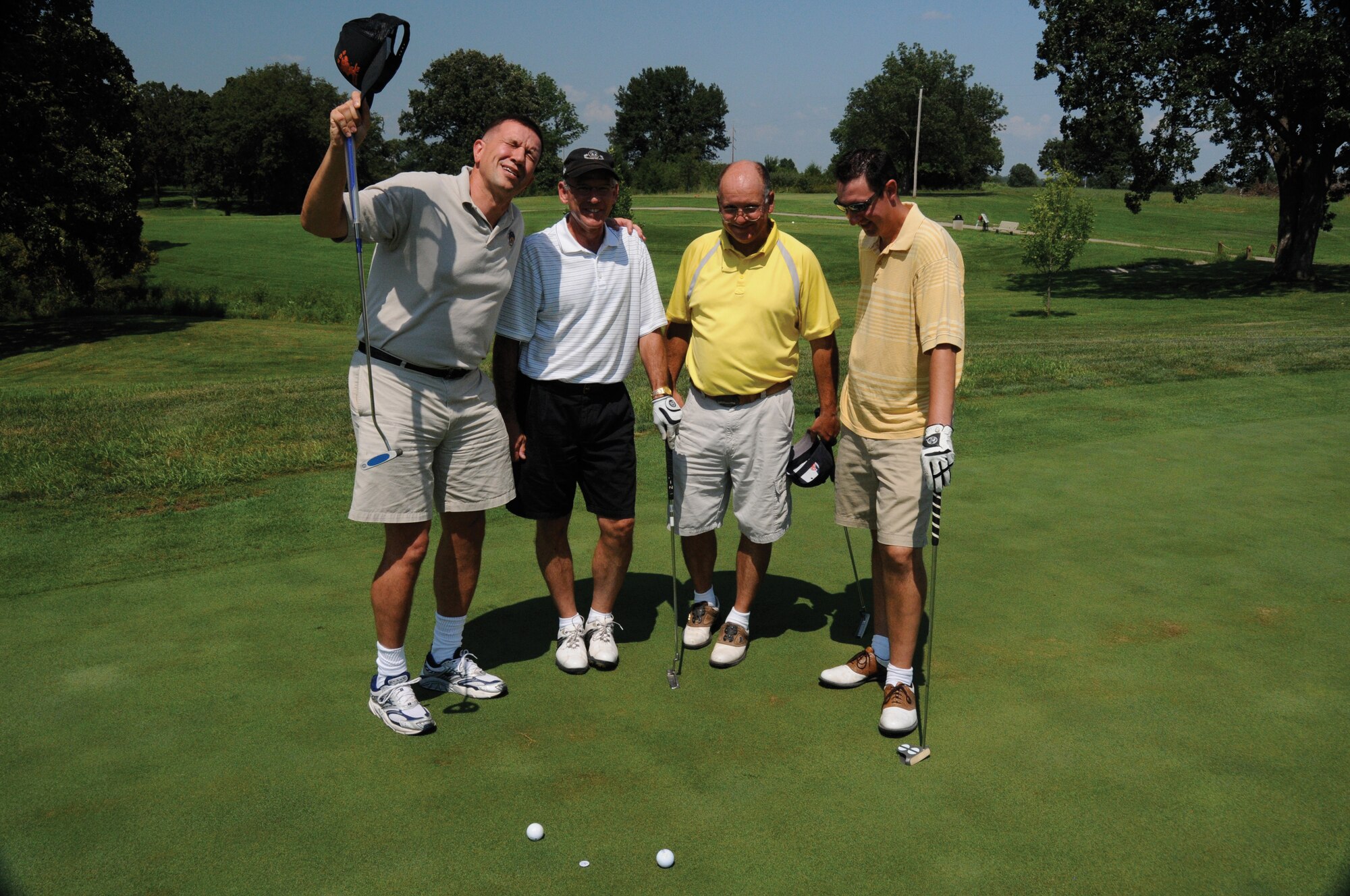 Chaplain (Maj.) James Buckman prays with his team prior to teeing off during the Wright Flight Golf Tournamend during the August unit training assembly. Chaplain Buckman is part of the 442nd Fighter Wing, an A-10 Thunderbolt II Air Force Reserve unit at Whiteman Air Force Base, Mo. (U.S. Air Force photo/Staff Sgt. Tom Talbert)