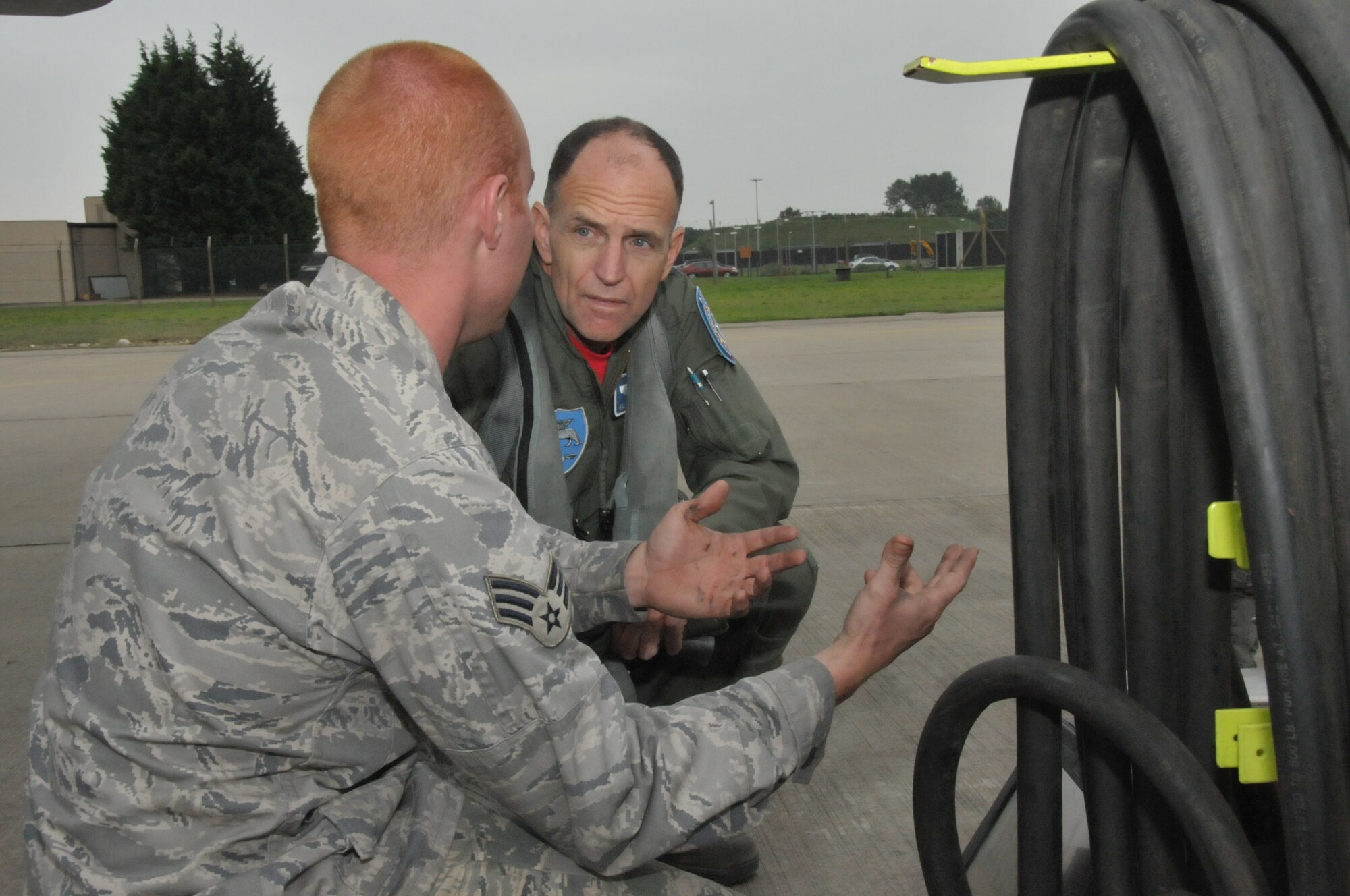 ROYAL AIR FORCE LAKENHEATH, England – Senior Airman Adam Prentice, 48th Aircraft Maintenance Squadron F-15 crew chief, explains an electronic technical order to Lt. Gen. Ralph J. Jodice II Commander, Allied Component Command Headquarters Izmir, Turkey, and Commander 16th Air Expeditionary Task Force, U.S. Air Forces in Europe, Izmir, Turkey, Sept. 10, 2010.  General Jodice is the guest speaker for the 2010 Air Force Ball at RAF Mildenhall, England.  (U.S. Air Force photo/Staff Sgt. Connor Estes)