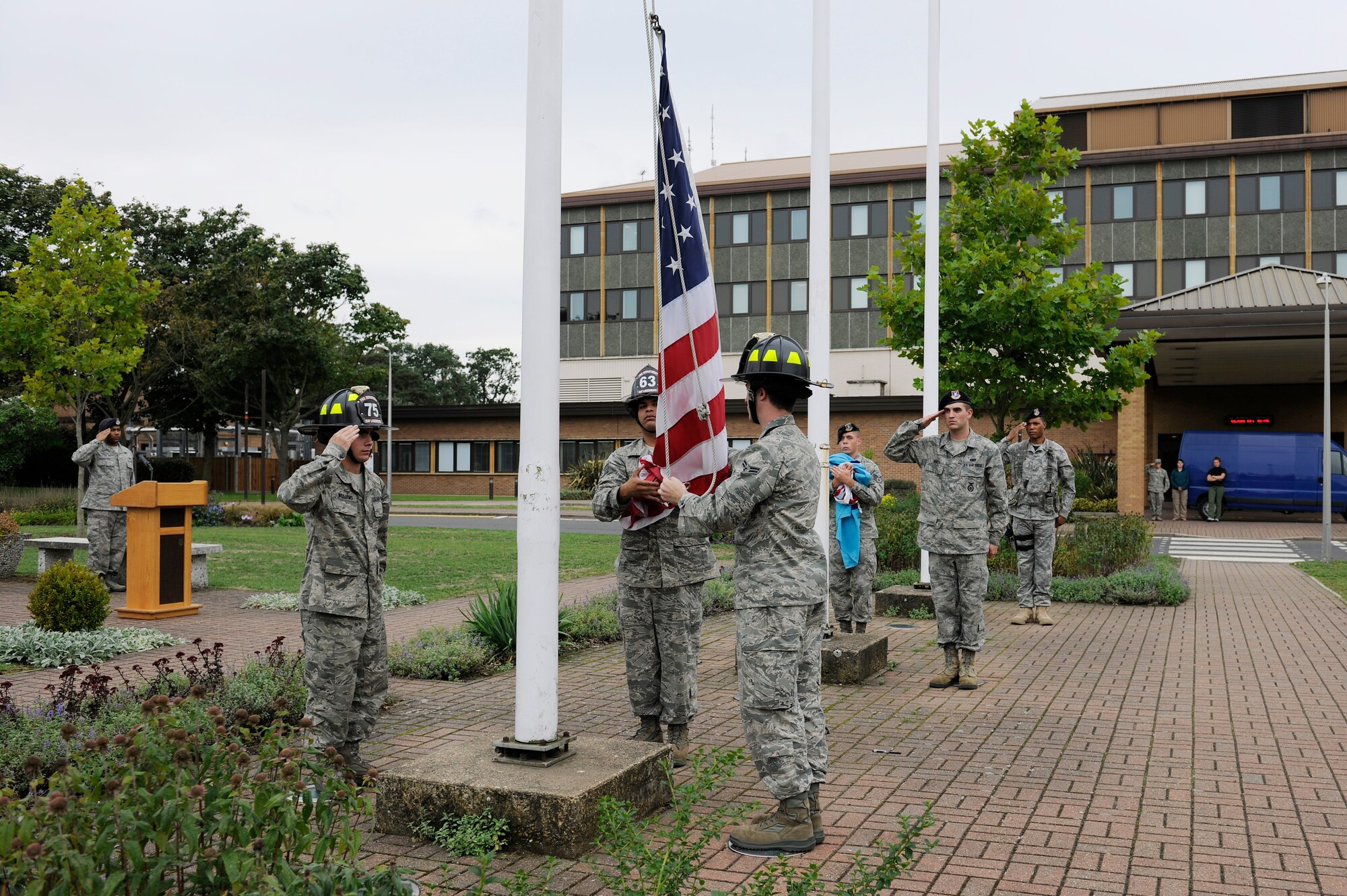 ROYAL AIR FORCE LAKENHEATH, England – Liberty Wing Airmen prepare to fold the American flag during the 9/11 Retreat Ceremony, Sept. 10, 2010. The flags were folded by members of the 48th Security Forces Squadron and the 48th Civil Engineer Squadron in honor of those who responded to the attack. (U.S. Air Force photo/Airman 1st Class Lausanne Morgan)