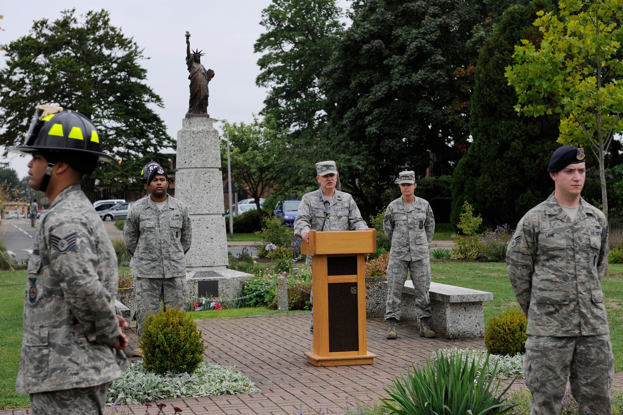 ROYAL AIR FORCE LAKENHEATH, England – Chaplain (Capt.) Franklin Watts, 48th Fighter Wing Chapel (middle), recites a benediction during the 9/11 Retreat Ceremony, Sept. 10, 2010.  The benediction was followed by brief speeches from a member of the 48th Security Forces Squadron and a firefighter from the 48th Civil Engineer Squadron. (U.S. Air Force photo/Airman 1st Class Lausanne Morgan)