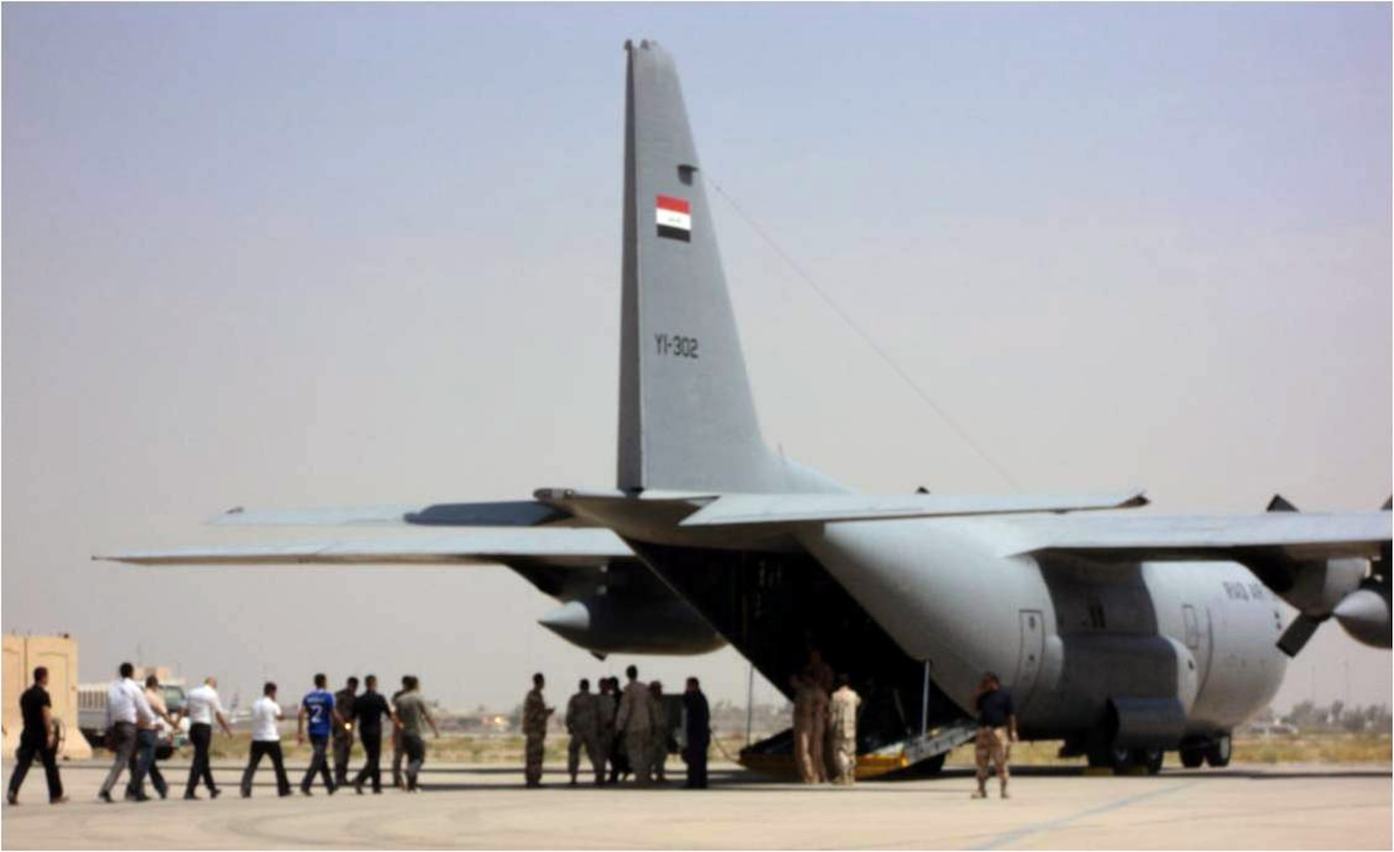 Cadets begin to board an Iraqi C-130, destined for the Iraqi Air Force College, located at Tikrit Air Base, Iraq.  The Air Force College recently opened and accepted its first class of students on September 1.  The opening of this institution is the latest accomplishment of the Iraqi Air Force along the path to achieving self-sustaining airpower capabilities.  (U.S. Air Force photo)
