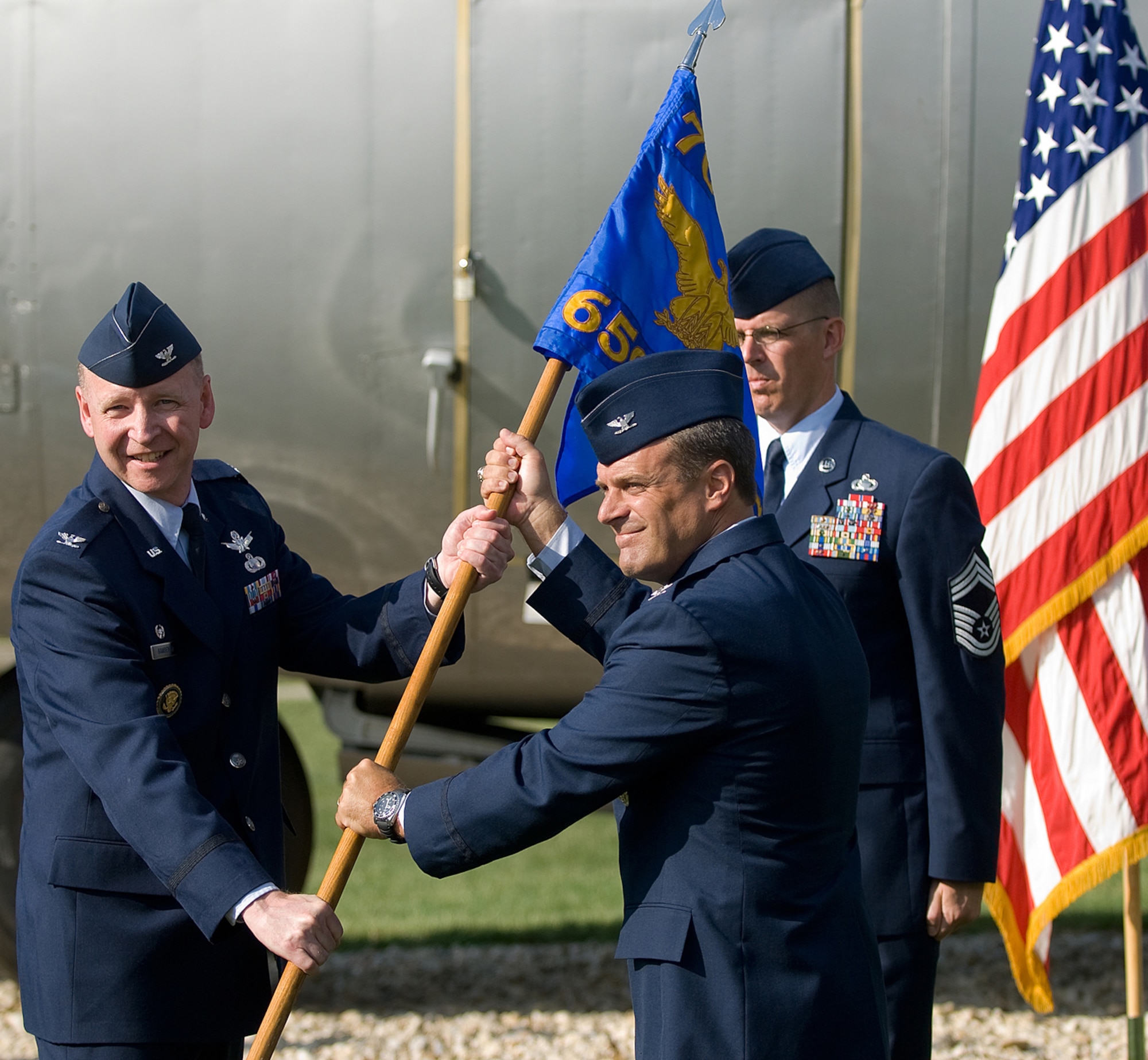Col. John Bansemer (left) passes the guidon of the just-activated 659th Intelligence, Surveillance and Reconnaissance Group to it first commander, Col. Peter Lambert, Sept. 8, 2010, during a ceremony at Fort George G. Meade, Md. The 659th ISR Group will provide ISR support to 24th Air Force and falls under command of the Air Force ISR Agency's 70th ISR Wing. (U.S. Army photo/Nicole Martyn)