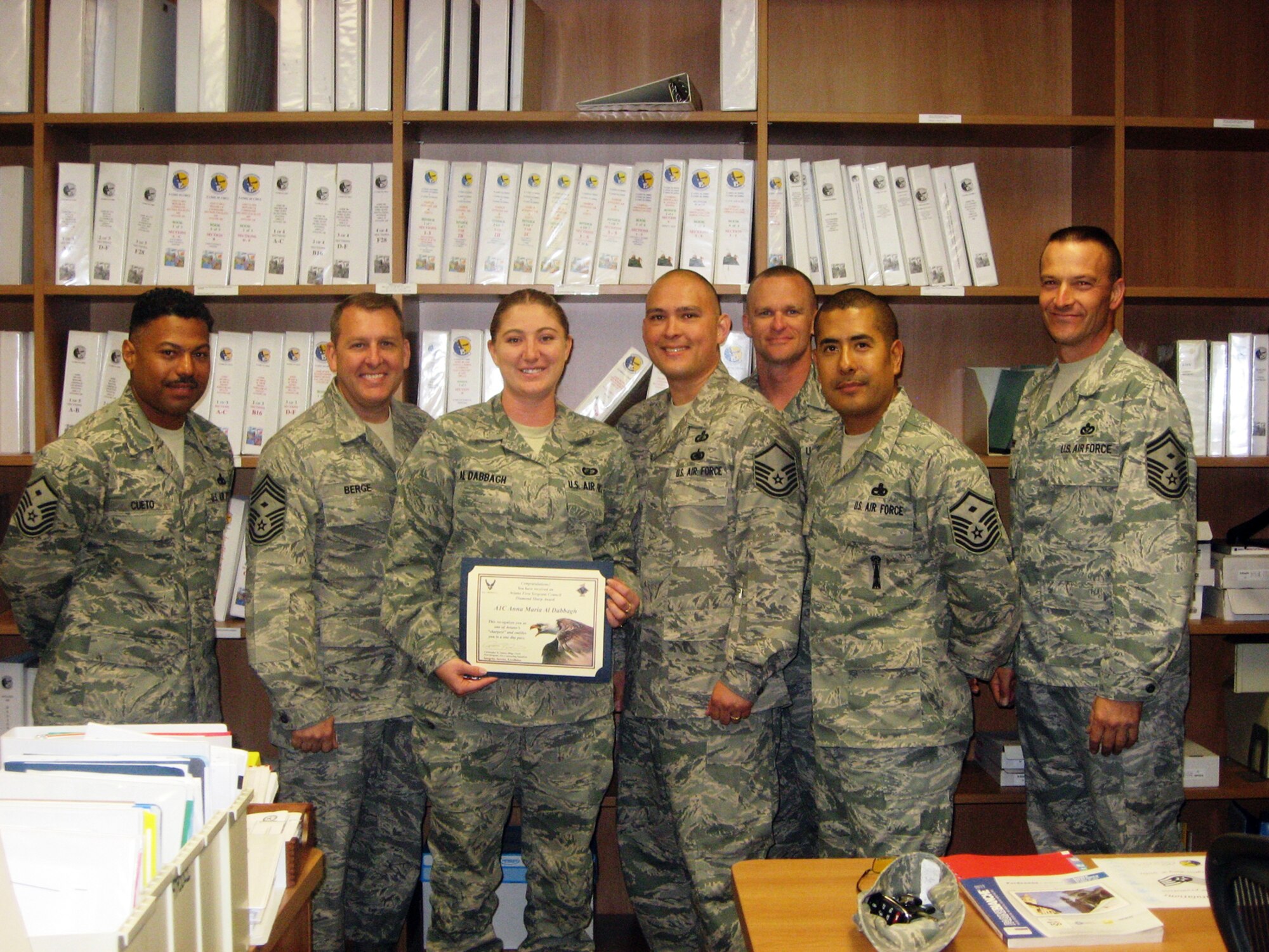 Airman 1st Class Anna Maria Al Dabbagh, 31st Contracting Squadron contracting specialist, receives the Aviano Diamond Sharp Award from the Aviano First Sergeants Council for leading Airmen in orchestrating the new Aviano Airmen Support for Families program. She has created avenues of care for use by commanders, first sergeants and key spouses to support base families while spouses are deployed. This program is completely voluntary and performed after normal duty hours. (Courtesy photo)