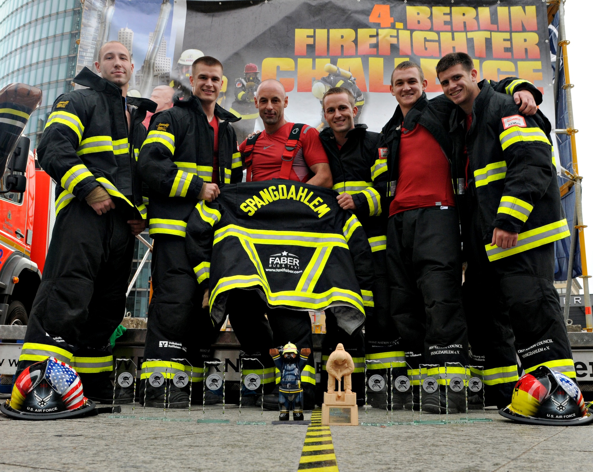 BERLIN – The Team Spangdahlem firefighters pose with their trophies after competing in the fourth Berlin Firefighter Combat Challenge Sept. 4. The team members earned three age division prizes, a second place team relay, a third place overall team and all of them placed in the top 40 of 240 competitors. (U.S. Air Force photo/Staff Sgt. Benjamin Wilson)