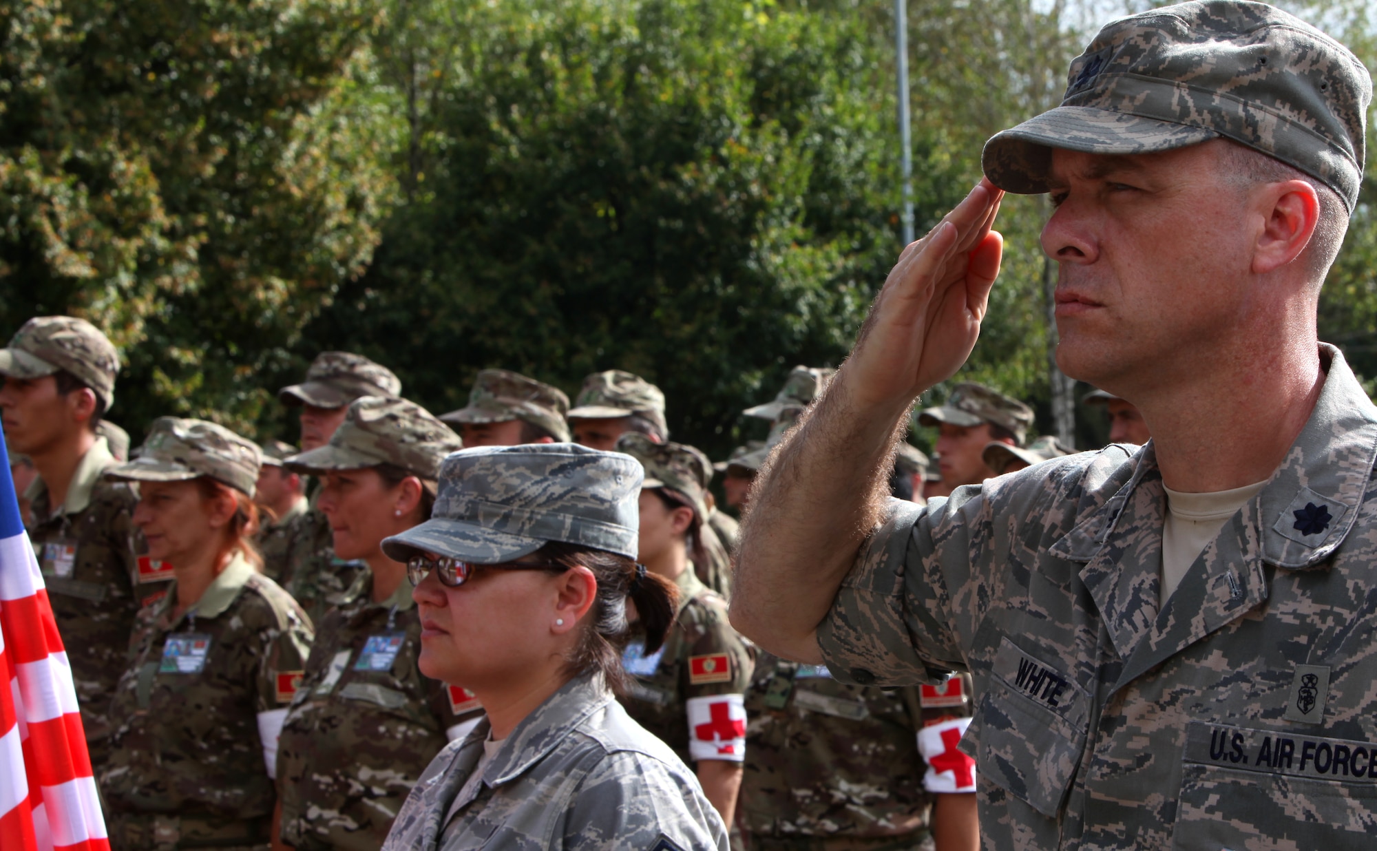 Lt. Col. Jeff White, commander of the Expeditionary Medical Squadron headquartered in RAF Lakenheath, England, salutes during opening ceremonies for MEDCEUR 2010, Sept. 10, on Danilovgrad Army Base, Montenegro. This exercise will provide training to these service members to strengthen emergency response and efficient medical treatment in the event of any real-world disasters or accidents. For more information, visit www.usafe.af.mil/medceur.asp and www.odbrana.gov.me. (U.S. Marine Corps photo/Lance Cpl. Jad Sleiman)