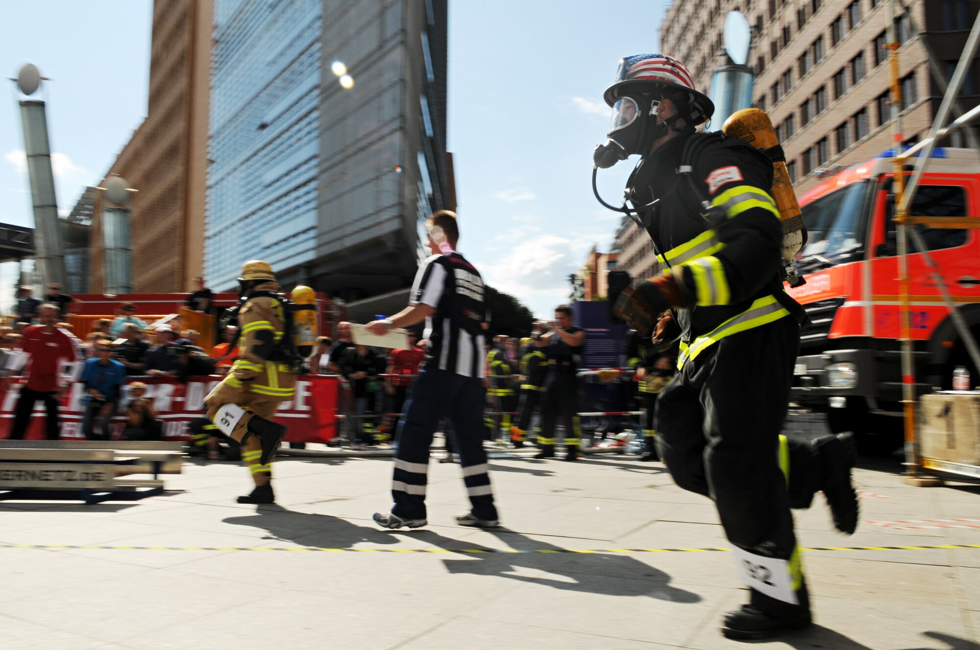 BERLIN – Staff Sgt. Chastin Warner, 52nd Civil Engineer Squadron firefighter, sprints between obstacles during his individual race in the fourth Berlin Firefighter Combat Challenge Sept. 4. Sergeant Warner earned first place in the overall event with a time of 1 minute, 44 seconds. (U.S. Air Force photo/Staff Sgt. Benjamin Wilson)