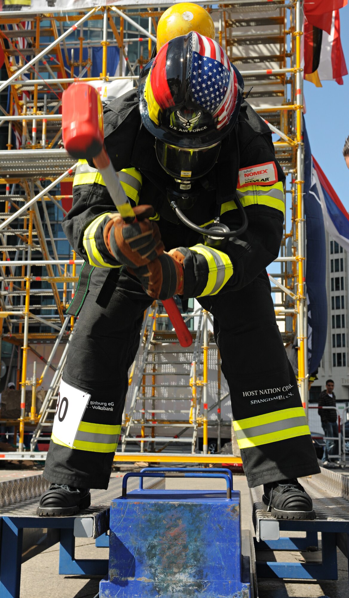 BERLIN – Senior Airman Brennen Cornett, 52nd Civil Engineer Squadron firefighter, pounds a keiser sled with a sledge hammer during his individual race in the fourth Berlin Firefighter Combat Challenge Sept. 4. Airman Cornett was one of six firefighters from Spangdahlem Air Base who competed in the event. (U.S. Air Force photo/Staff Sgt. Benjamin Wilson)