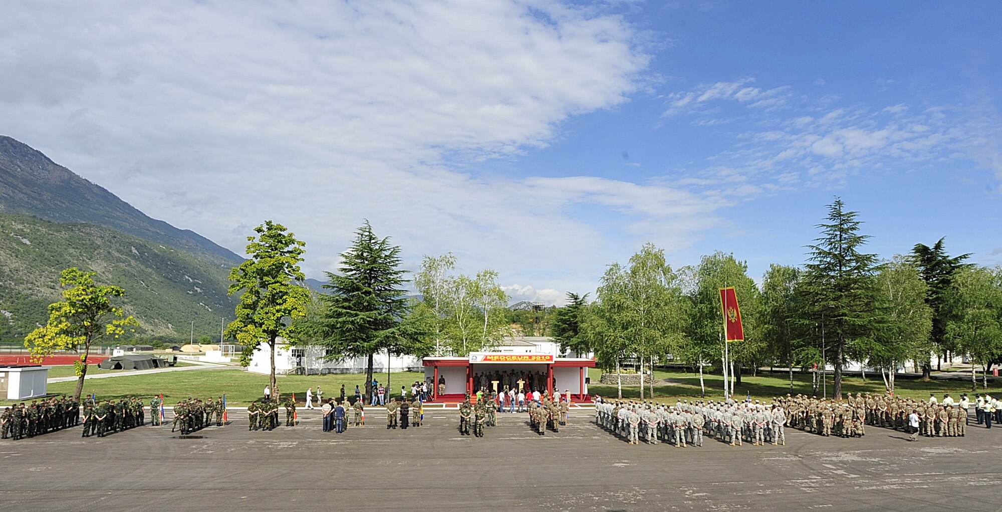 Servicemembers from Armenia, Azerbaijan, Bosnia and Herzegovina, Georgia, Macedonia, Moldova, Montenegro, Serbia, Ukraine and the United States stand in formation together at Danilovgrad Army Base, Montenegro, Sept. 10. The ten nations have gathered to work together during MEDCEUR 10, a medical training exercise in central and eastern Europe. This exercise will provide training that will give these servicemembers a strengthened emergency and medical response in the event of any real-world disasters or accidents. For more information, visit www.usafe.af.mil/medceur.asp and www.odbrana.gov.me. (U.S. Air Force photo/Airman 1st Class Tiffany Deuel)